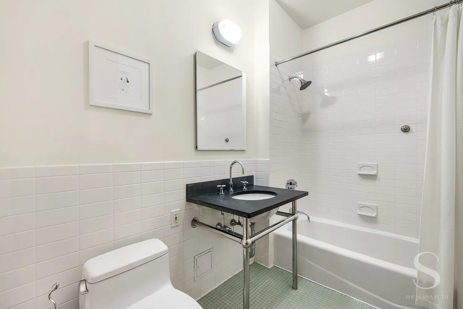 a bathroom with a sink a toilet and a bathtub