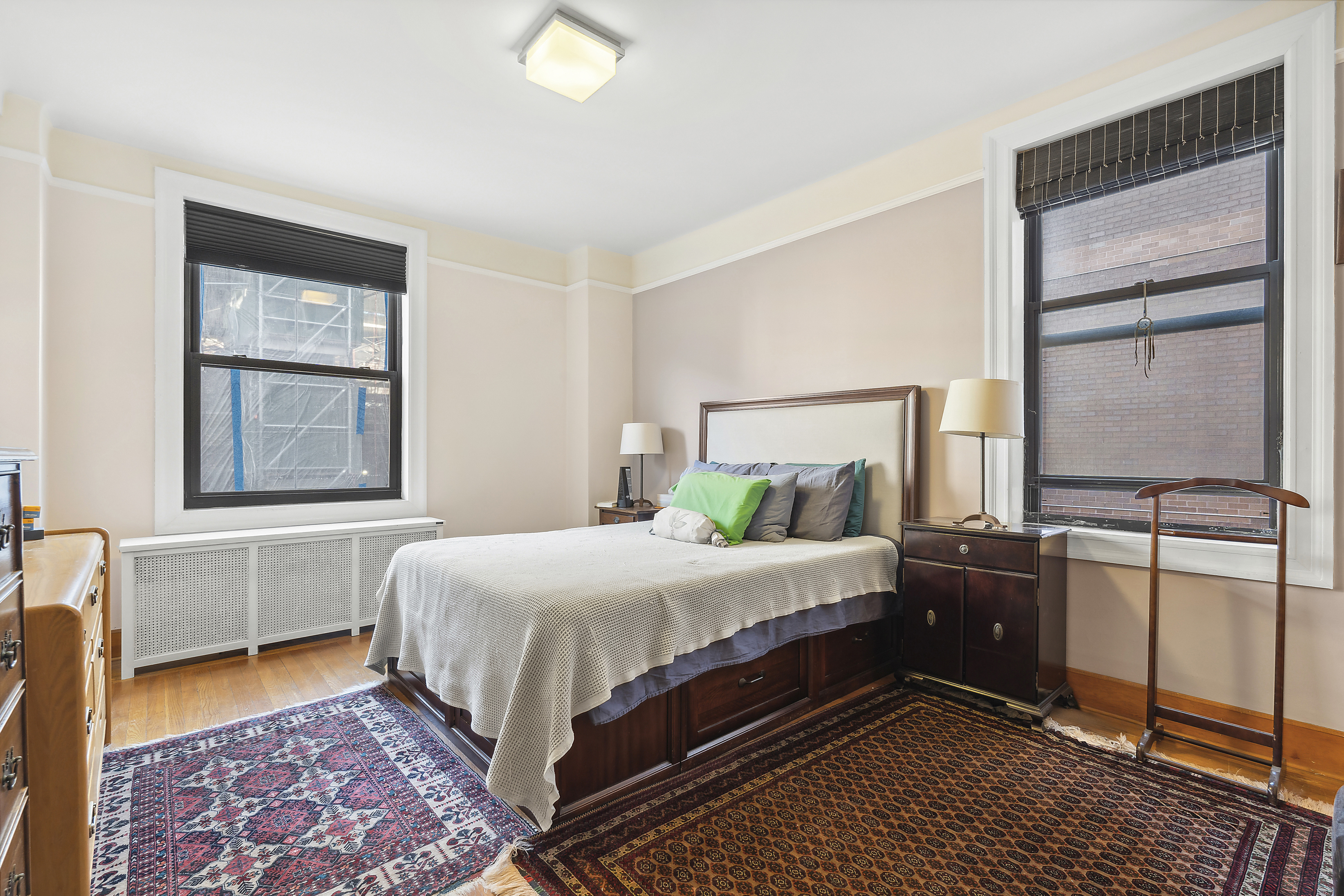 395 Riverside Drive, Unit 5F Manhattan, NY 10025 - Photo 4 of 8 a bedroom with a bed and wooden floor