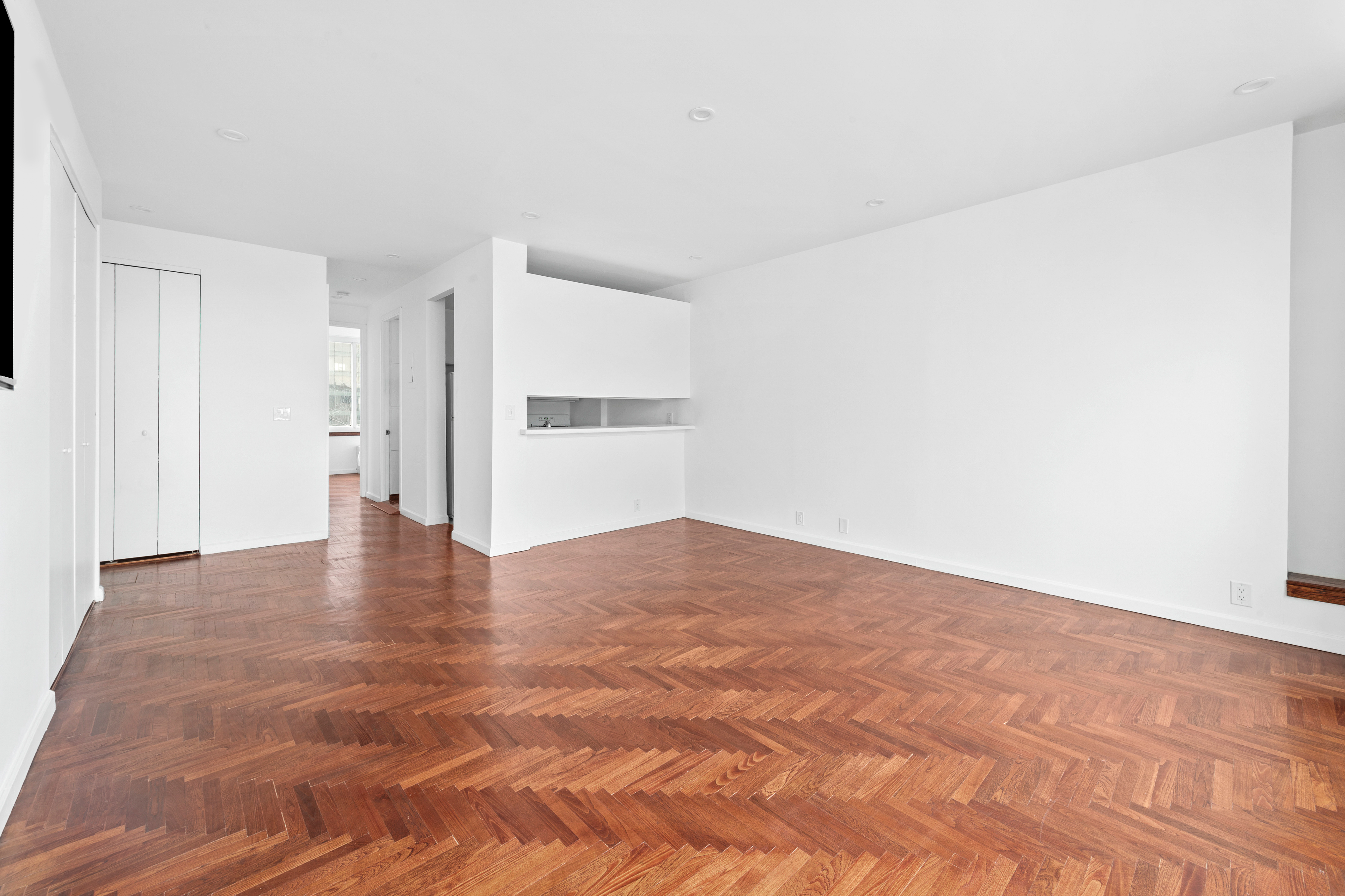 524 East 72nd Street, Unit 26A Manhattan, NY 10021 - Photo 4 of 16 a view of empty room with wooden floor