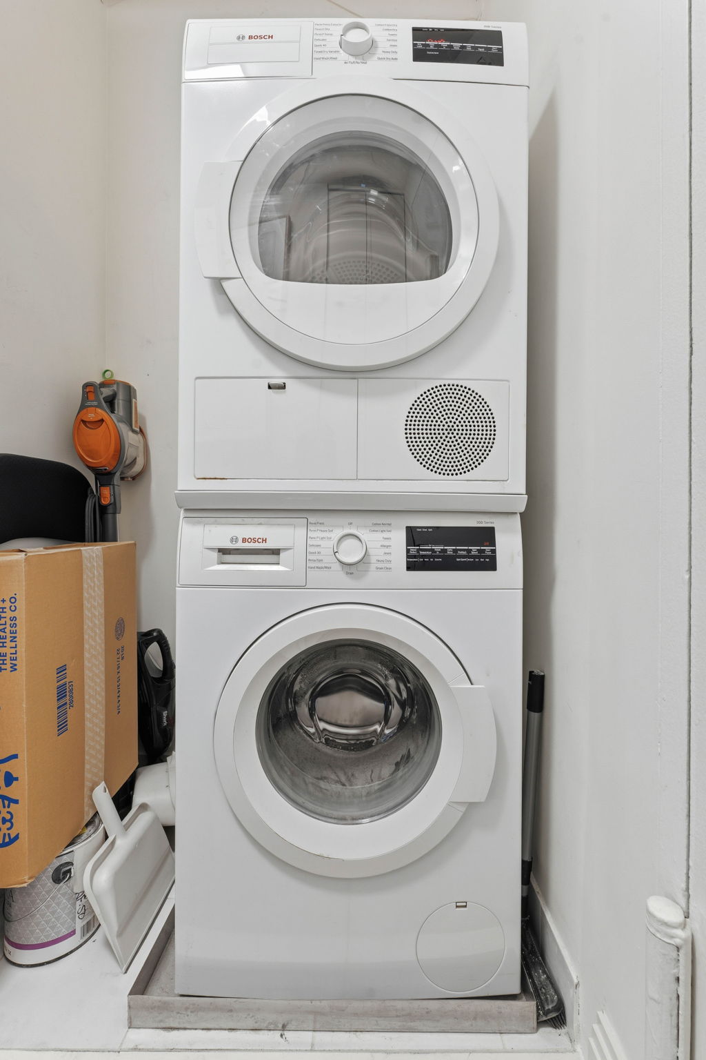 245 East 87th Street, Unit 17C Manhattan, NY 10128 - Photo 9 of 11 a utility room with dryer and washer