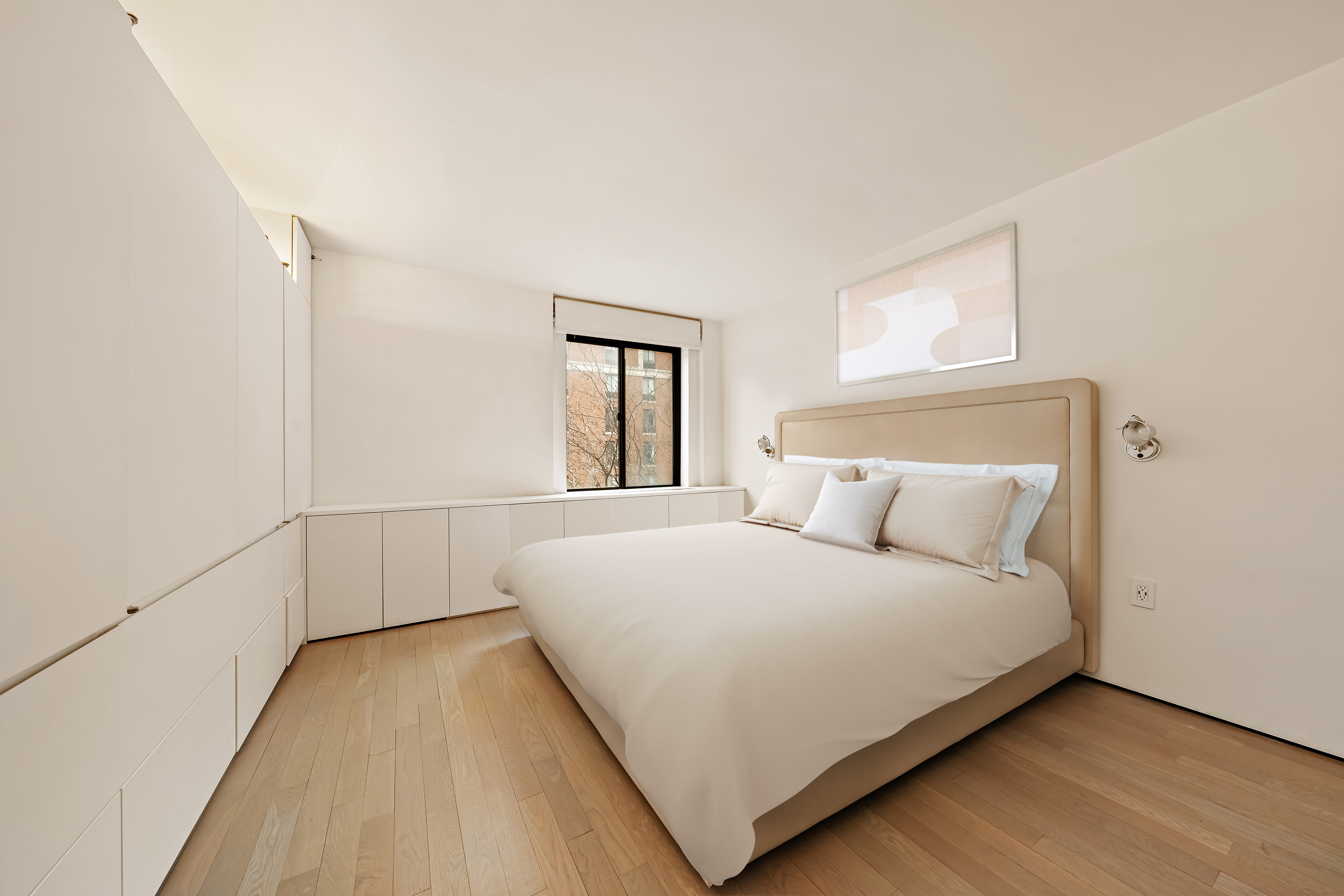 280 Rector Place, Unit 5IJ Manhattan, NY 10280 - Photo 4 of 10 a bedroom with a bed and a night stand