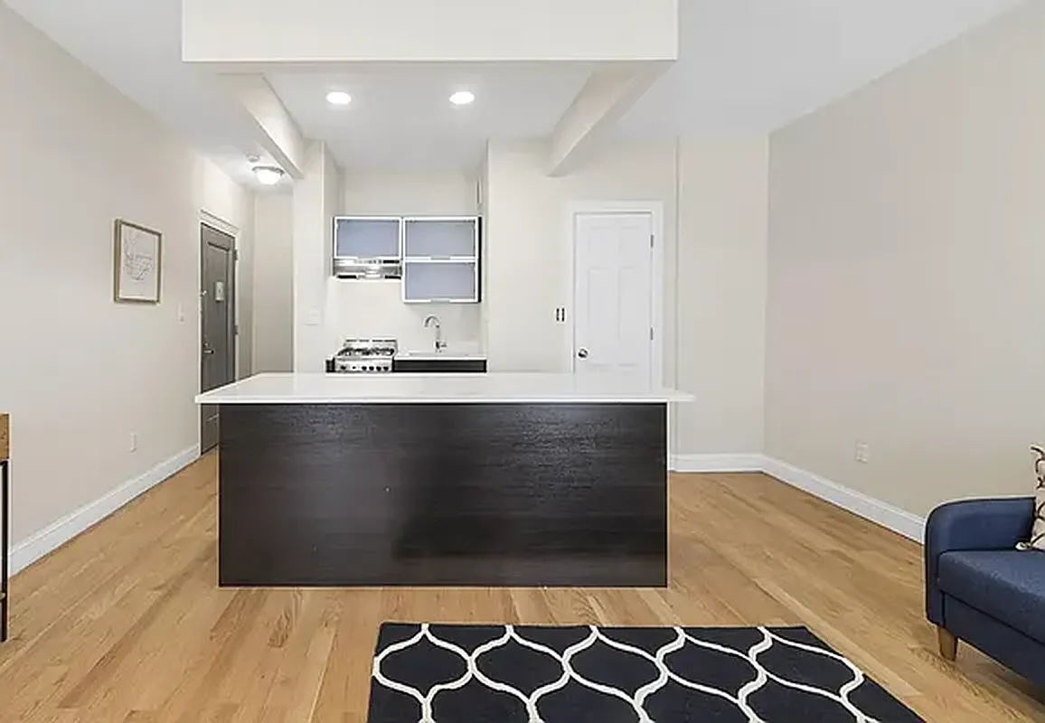1436 Lexington Avenue, Unit 1B Manhattan, NY 10128 - Photo 2 of 4 a view of kitchen cabinets and wooden floor