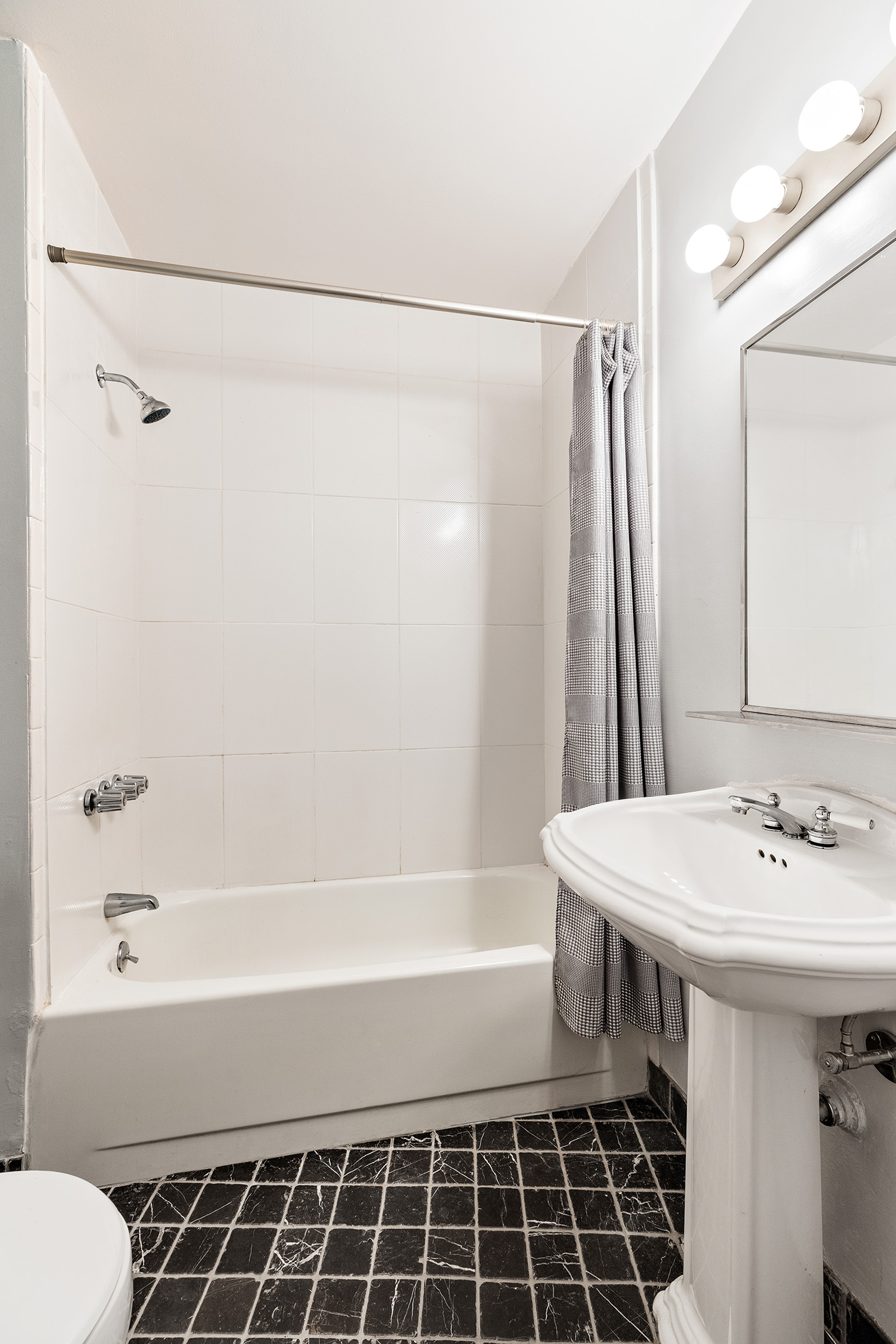 15 West 24th Street Manhattan, NY 10010 - Photo 8 of 14 a bathroom with a sink a toilet and shower