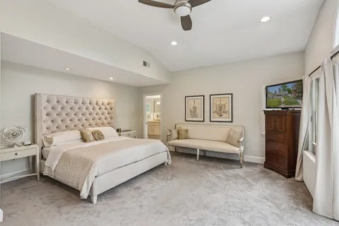 a bedroom with a bed and furniture