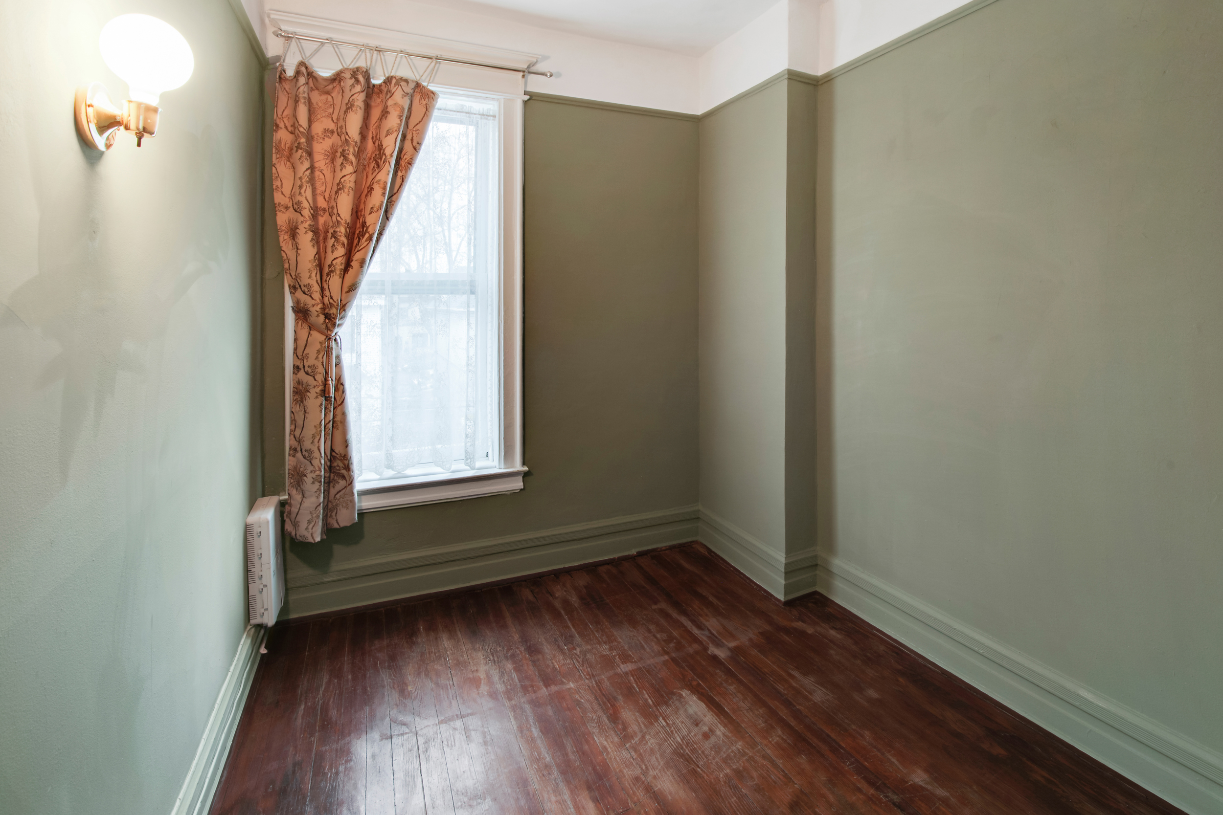 425 81st Street Brooklyn, NY 11209 - Photo 11 of 13 a view of a small space with wooden floor and a window