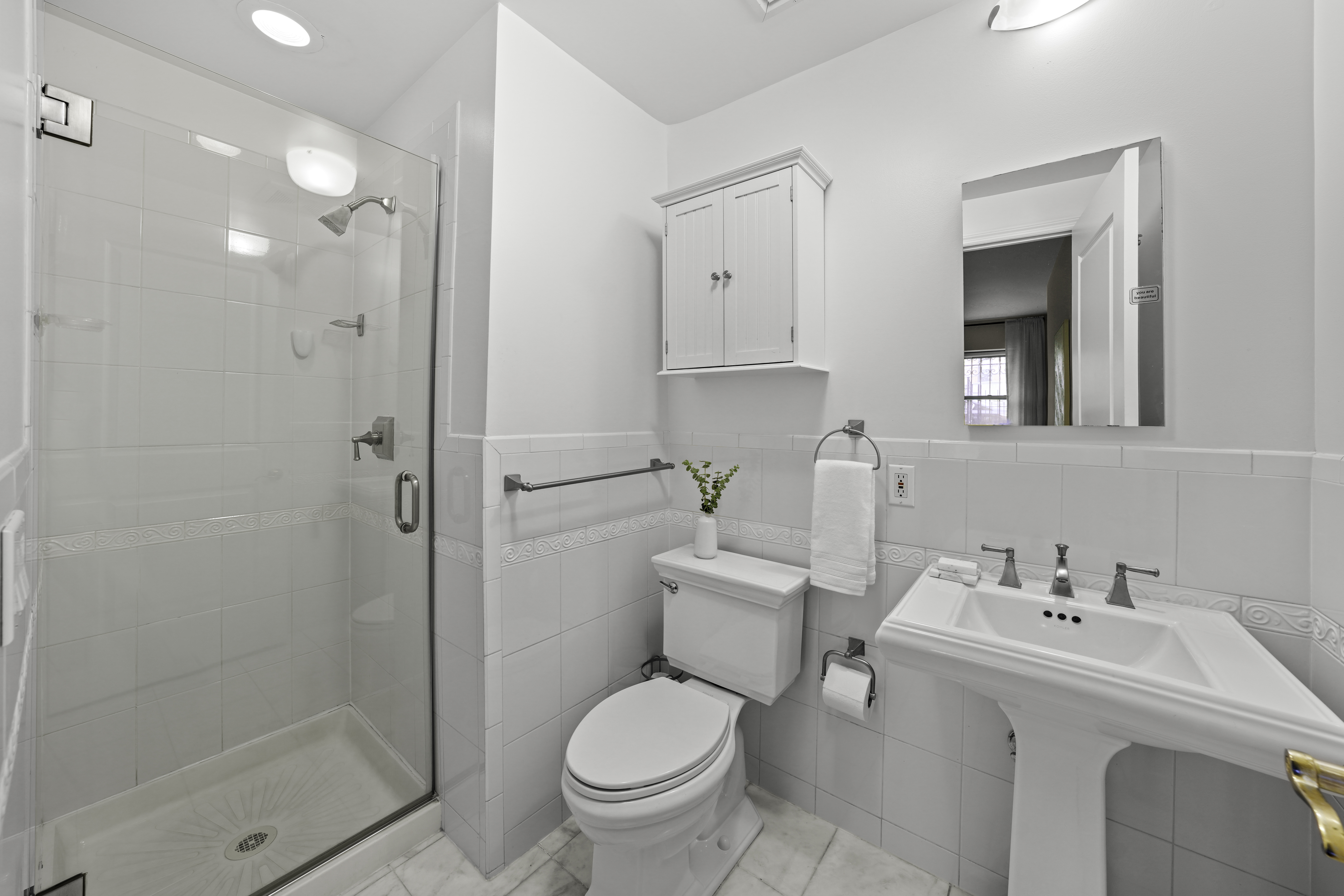 714 St Nicholas Avenue, Unit 1 Manhattan, NY 10031 - Photo 13 of 18 a bathroom with a toilet sink and shower