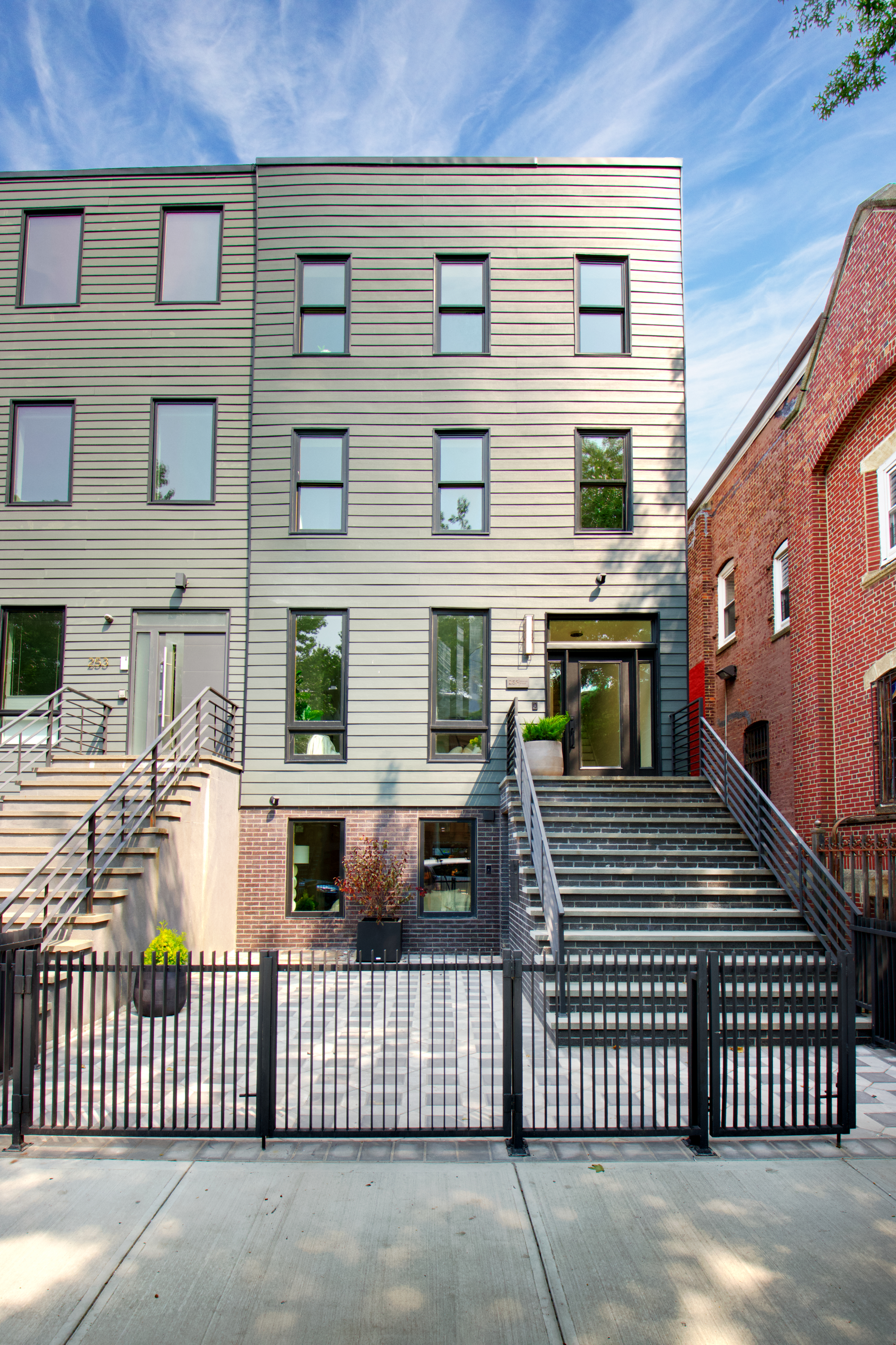 255 Macon Street Brooklyn, NY 11216 - Photo 32 of 36 a front view of a house with a fence