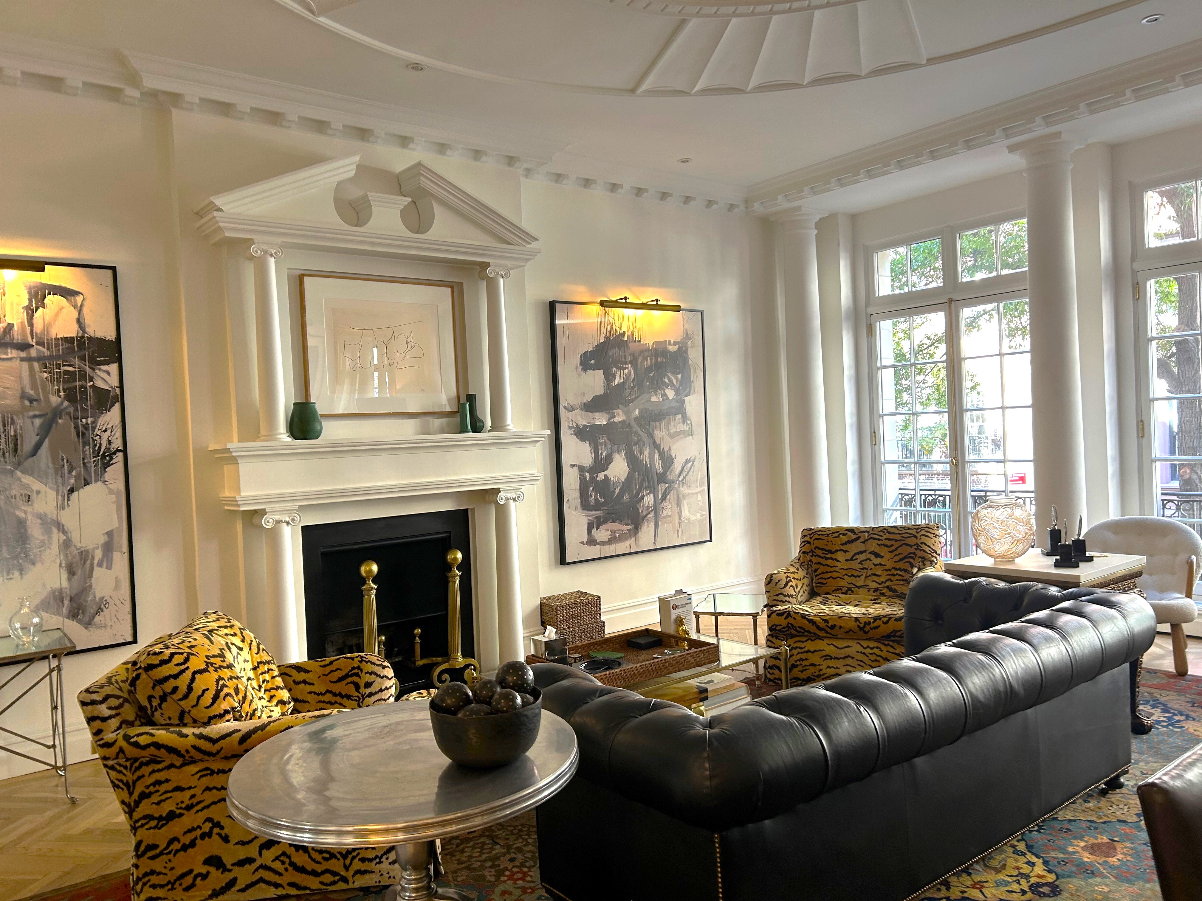 36 East 69th Street, Unit 2AB Manhattan, NY 10021 - Photo 13 of 26 a living room with furniture a fireplace and a chandelier