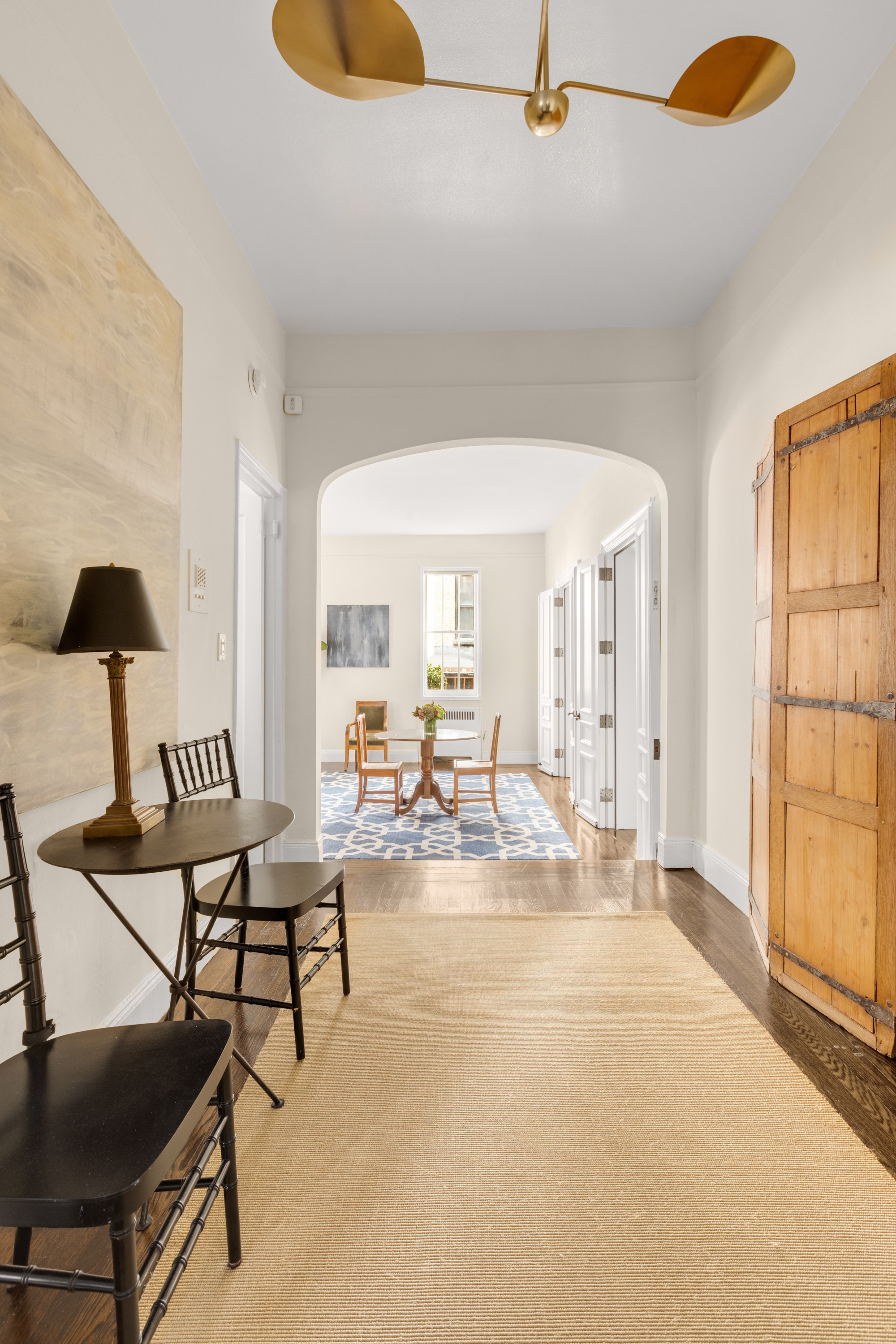 51 East 78th Street, Unit 3BC Manhattan, NY 10075 - Photo 9 of 25 a living room with furniture and a window