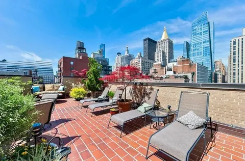 a view of a chairs and table in a patio