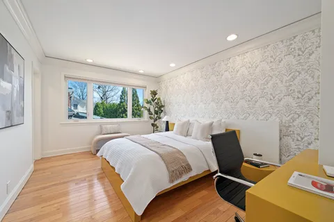 a bedroom with bed and a window