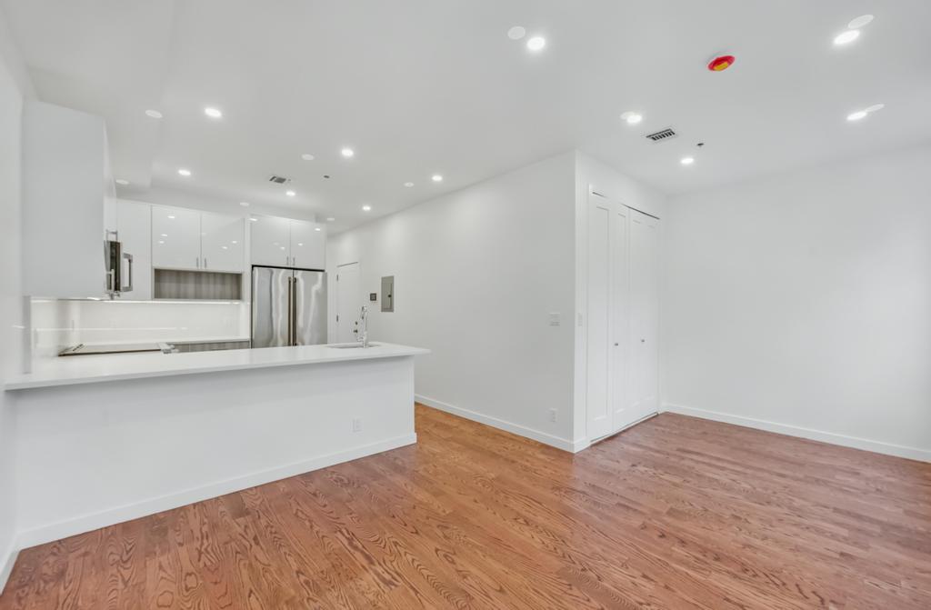 109 President Street, Unit 4 Brooklyn, NY 11231 - Photo 6 of 22 a view of kitchen with stainless steel appliances cabinets and wooden floor