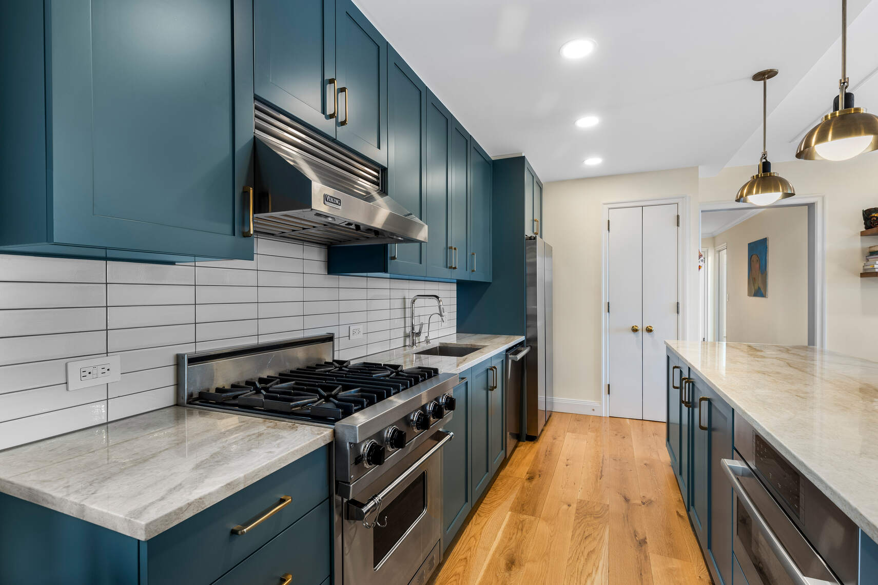 47 Plaza Street West, Unit 5B Brooklyn, NY 11217 - Photo 4 of 14 a kitchen with stainless steel appliances granite countertop a stove and a sink