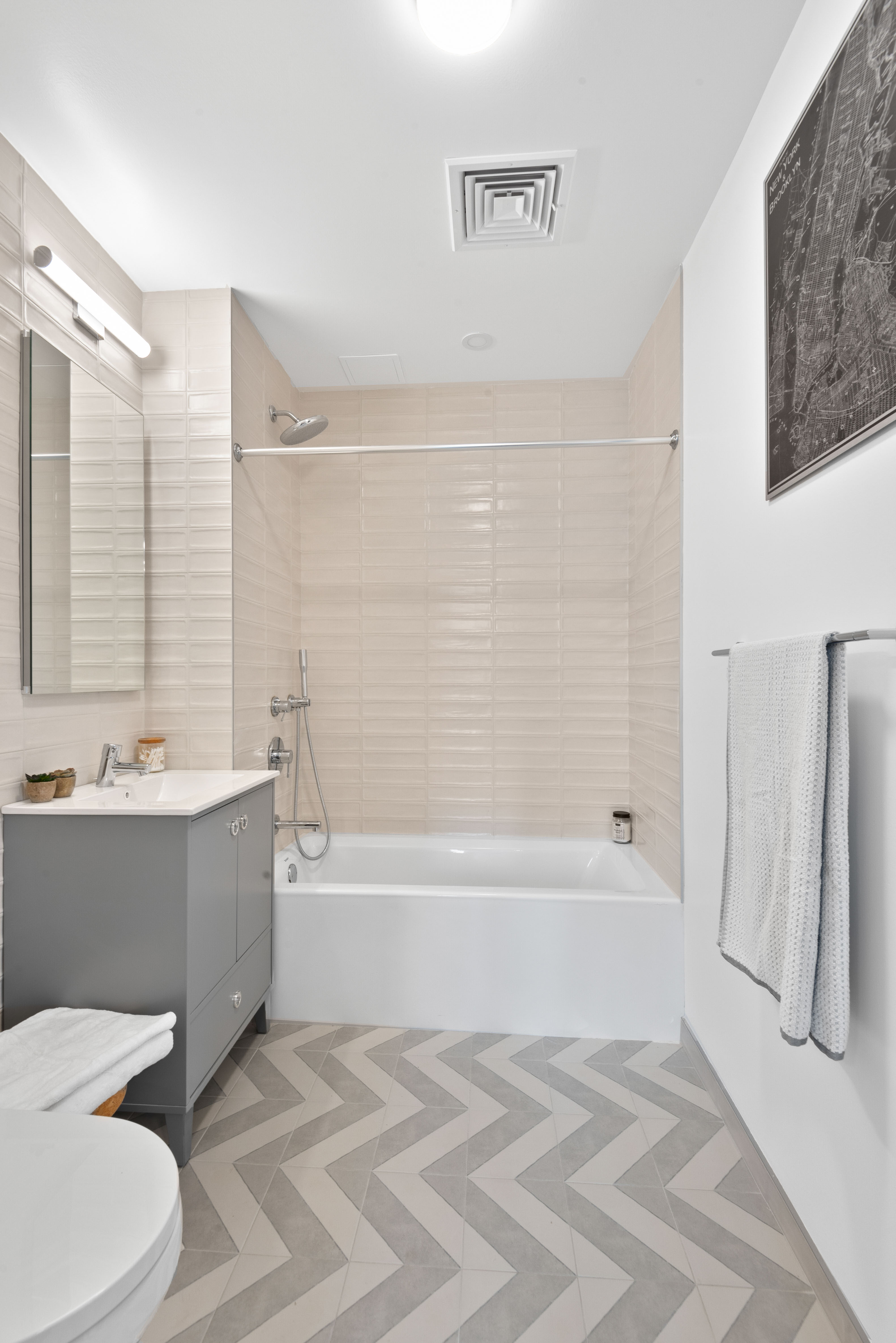 1 Lenox Road, Unit 5E Brooklyn, NY 11226 - Photo 5 of 13 a bathroom with a sink toilet and bathtub