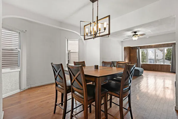 a view of a dining room with furniture window and wooden floor