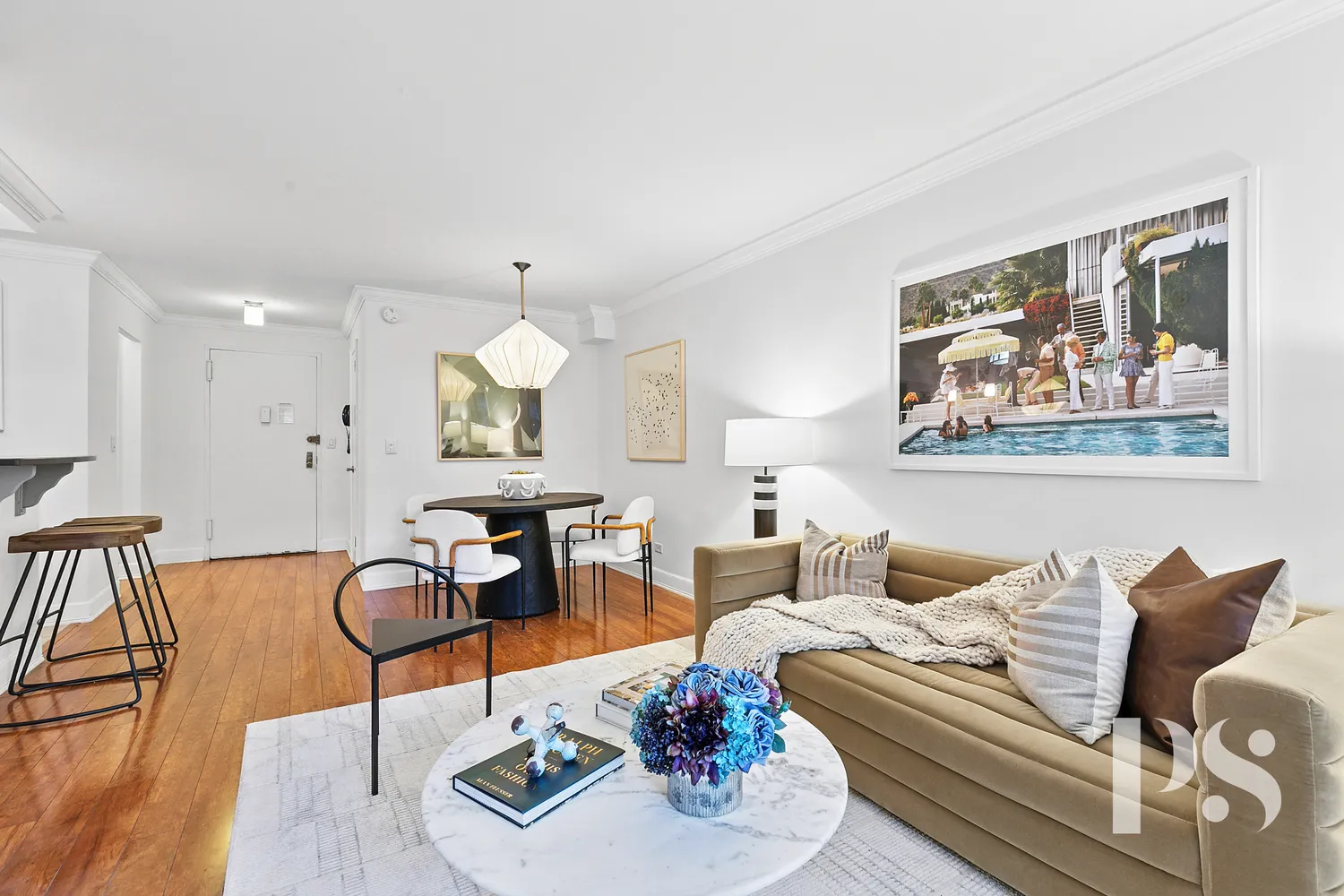 a living room with furniture and wooden floor