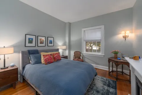 a bedroom with bed and a window