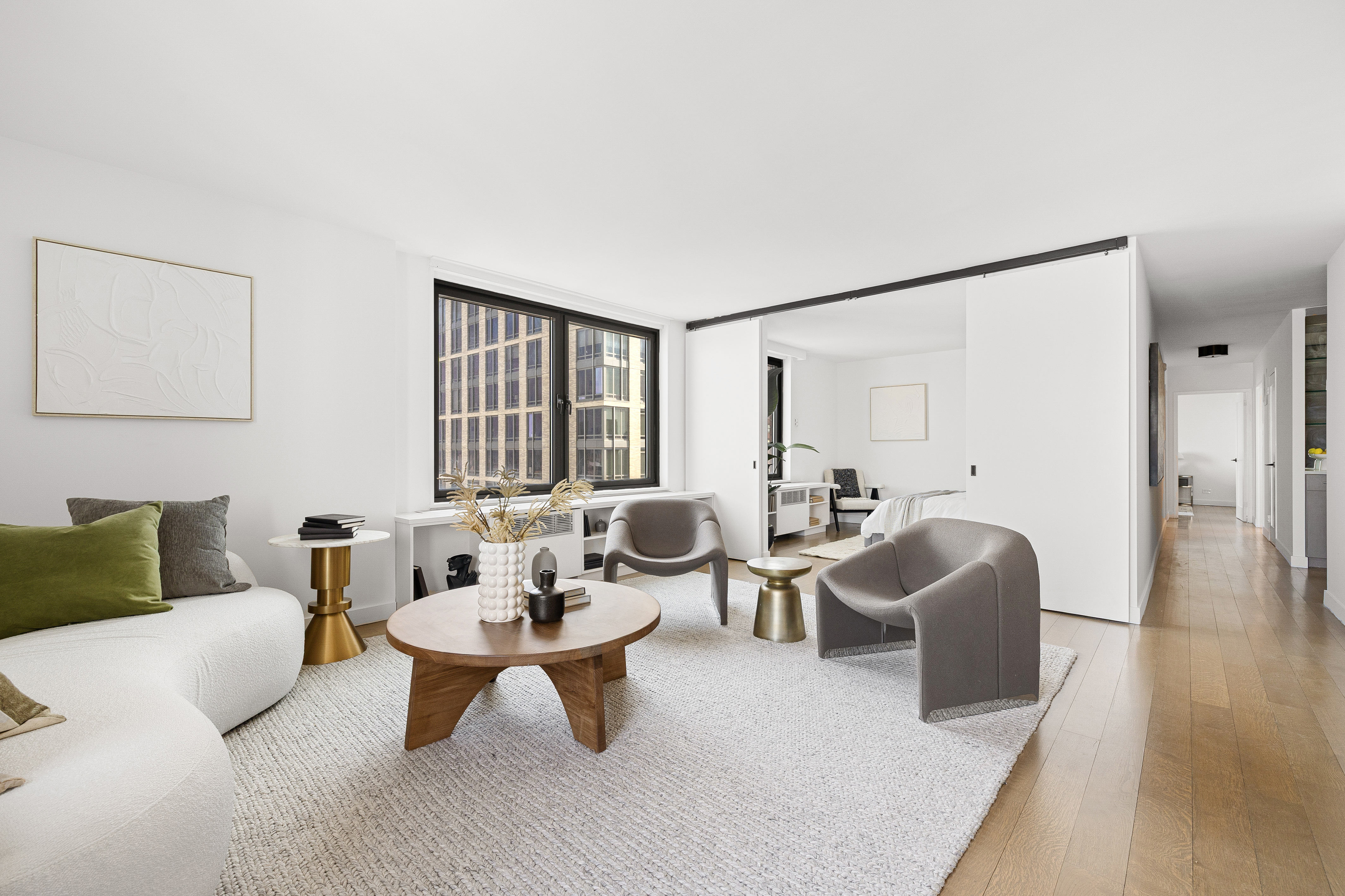 1623 3rd Avenue, Unit 36A Manhattan, NY 10128 - Photo 5 of 17 a living room with furniture and a white walls