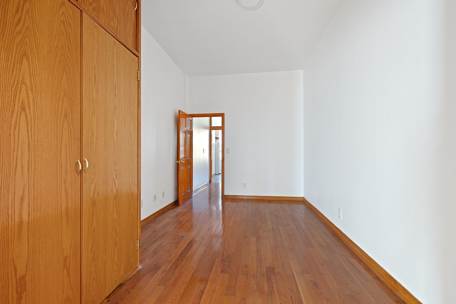 83 Maujer Street, Unit 2R Brooklyn, NY 11206 - Photo 2 of 6 a view of a hallway with wooden floor