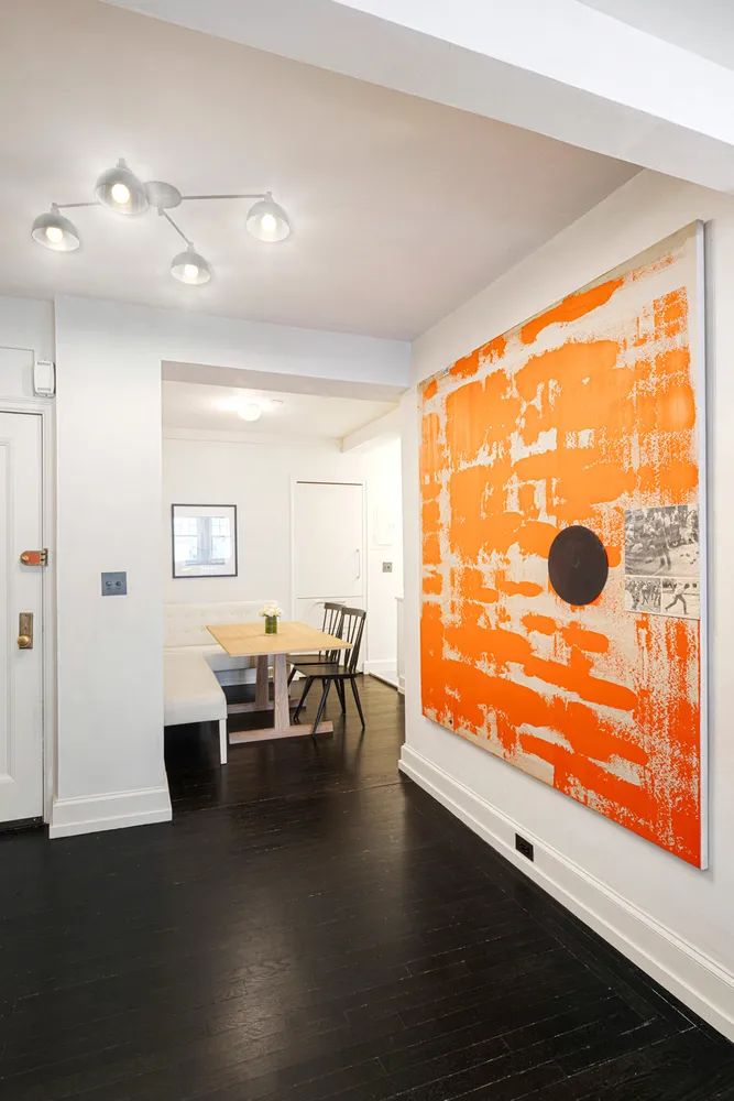 a dining room with furniture and wooden floor