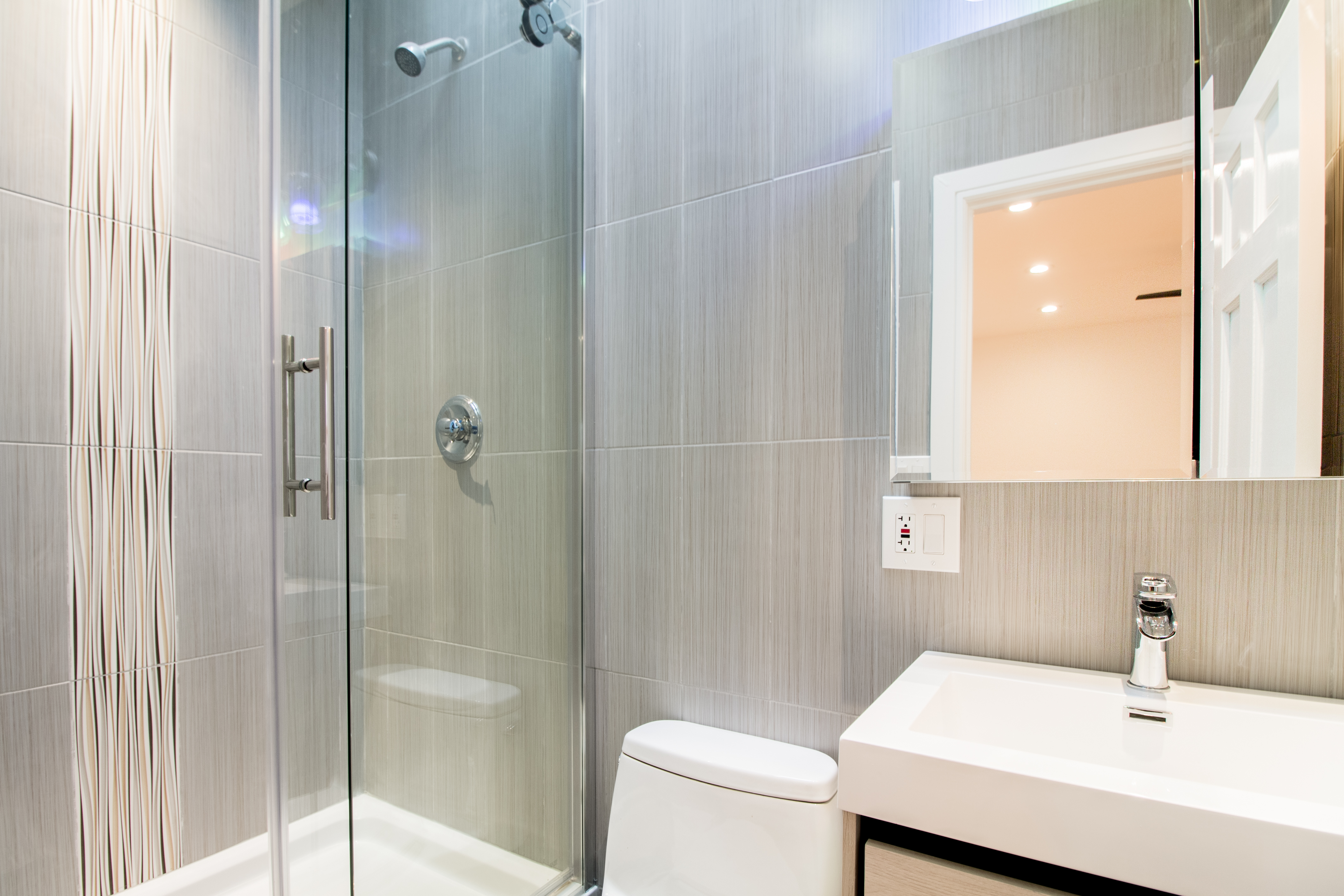 1923 Cornelia Street, Unit 2F Queens, NY 11385 - Photo 7 of 9 a bathroom with a sink and a mirror