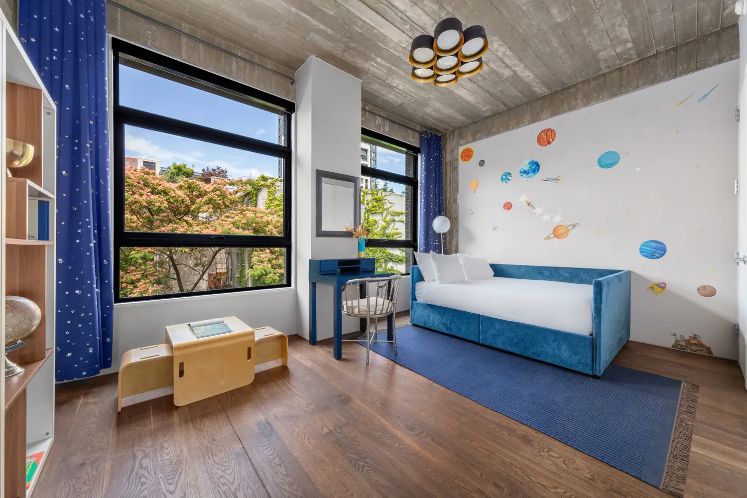 a bedroom with furniture and a large window