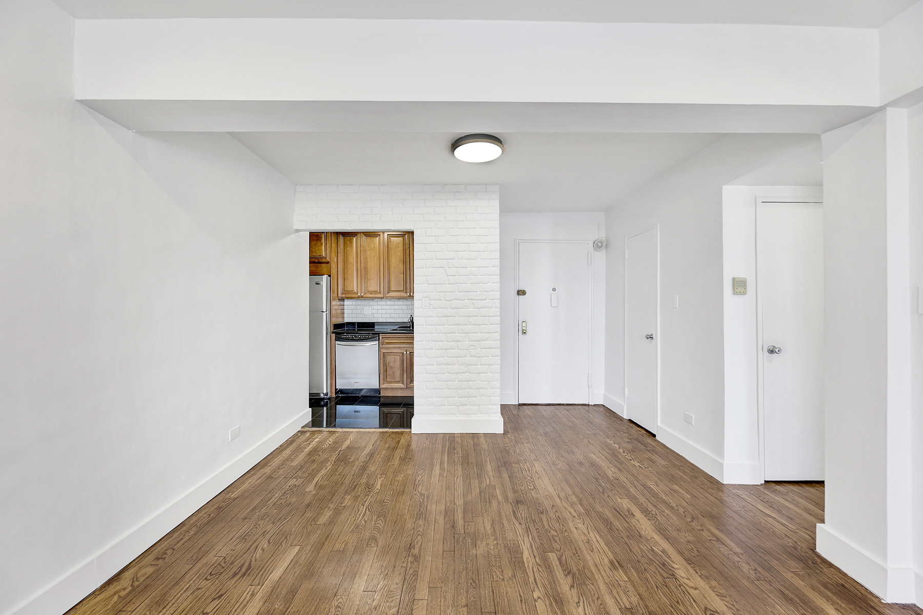125 Beach 124th Street, Unit 5K Queens, NY 11694 - Photo 12 of 21 a view of empty room with wooden floor