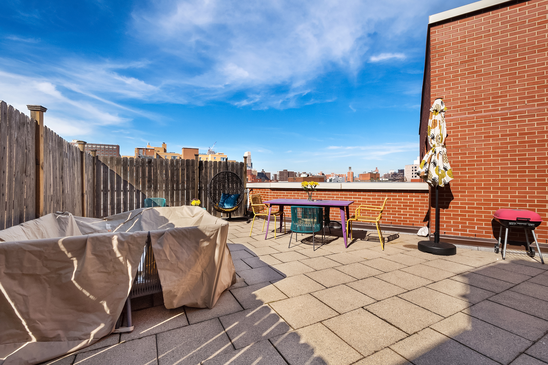 163 St Nicholas Avenue, Unit PH7A Manhattan, NY 10026 - Photo 9 of 11 a view of a terrace with furniture