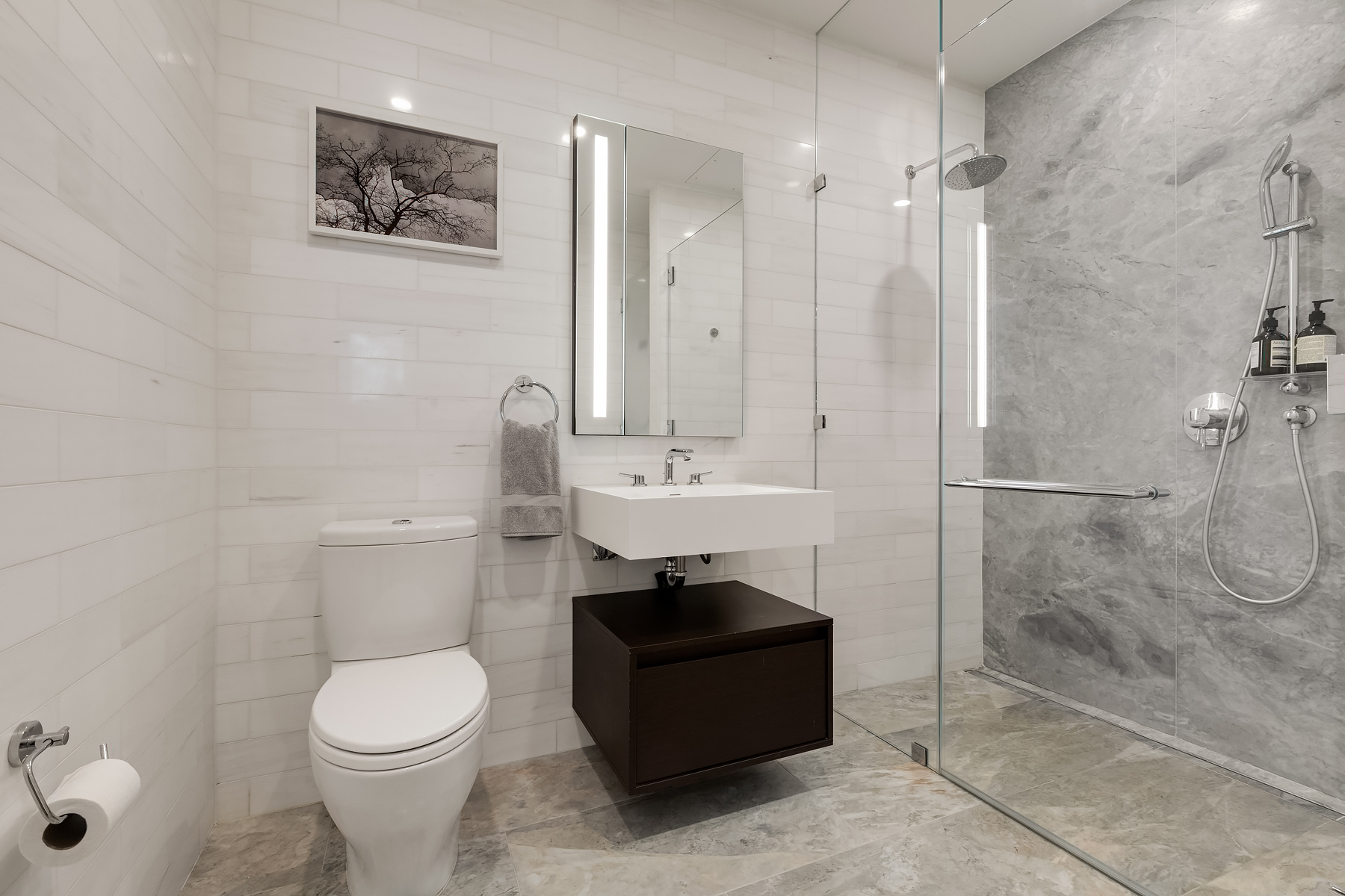 287 East Houston Street, Unit 4C Manhattan, NY 10002 - Photo 6 of 12 a bathroom with a sink toilet and shower