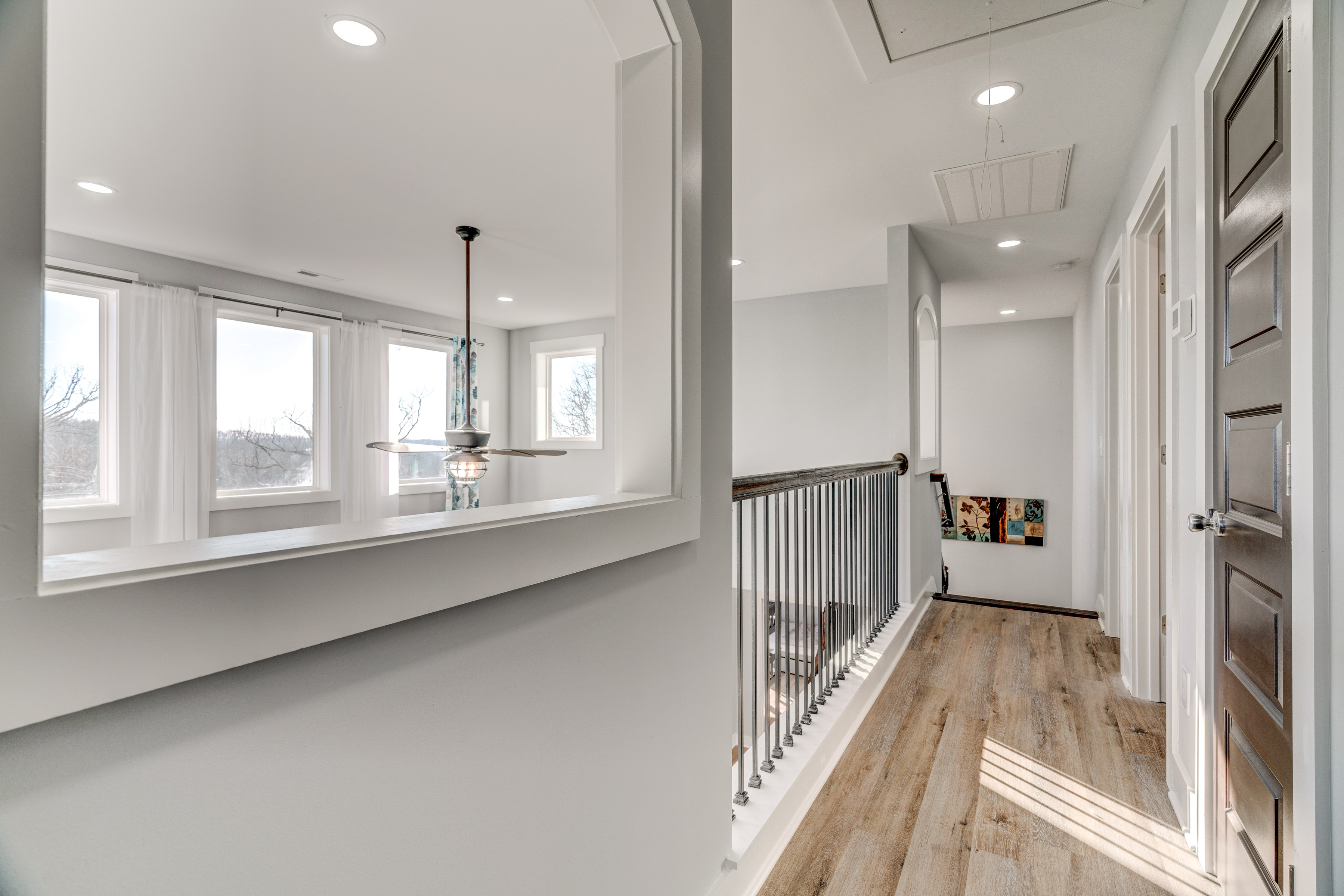 Happy Hollow Road Goodlettsville, TN 37072 - Photo 77 of 203 a view of a hallway with wooden floor and staircase
