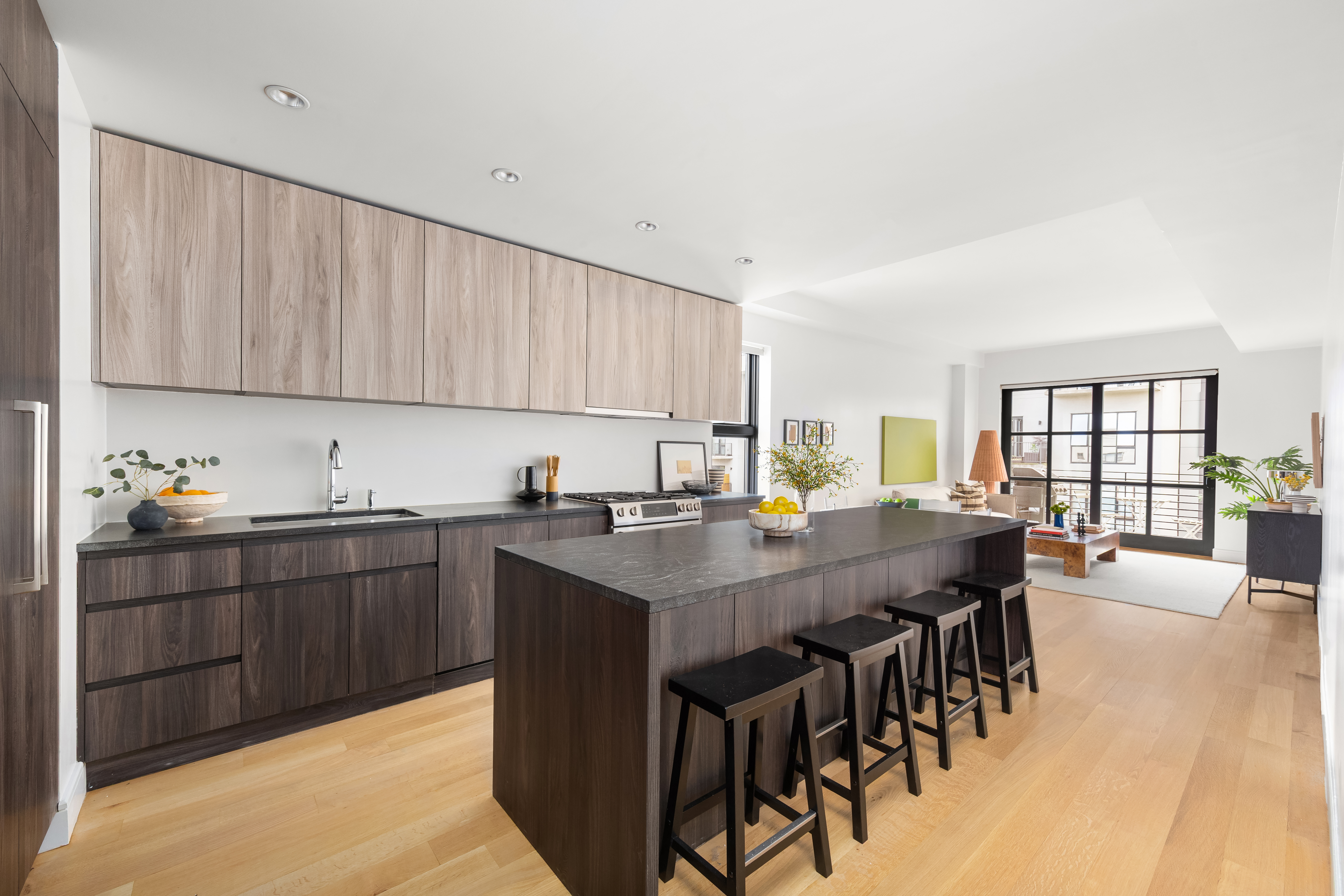 868 Lorimer Street, Unit 3C Brooklyn, NY 11222 - Photo 2 of 11 a view of kitchen with sink dining table and chairs
