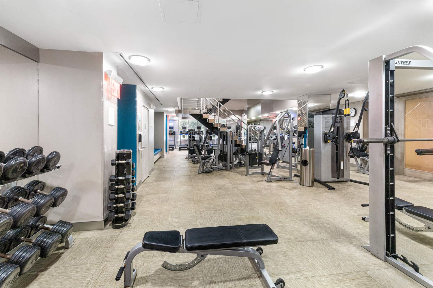 225 Rector Place, Unit 7M Manhattan, NY 10280 - Photo 8 of 13 a room with gym equipment and a large window