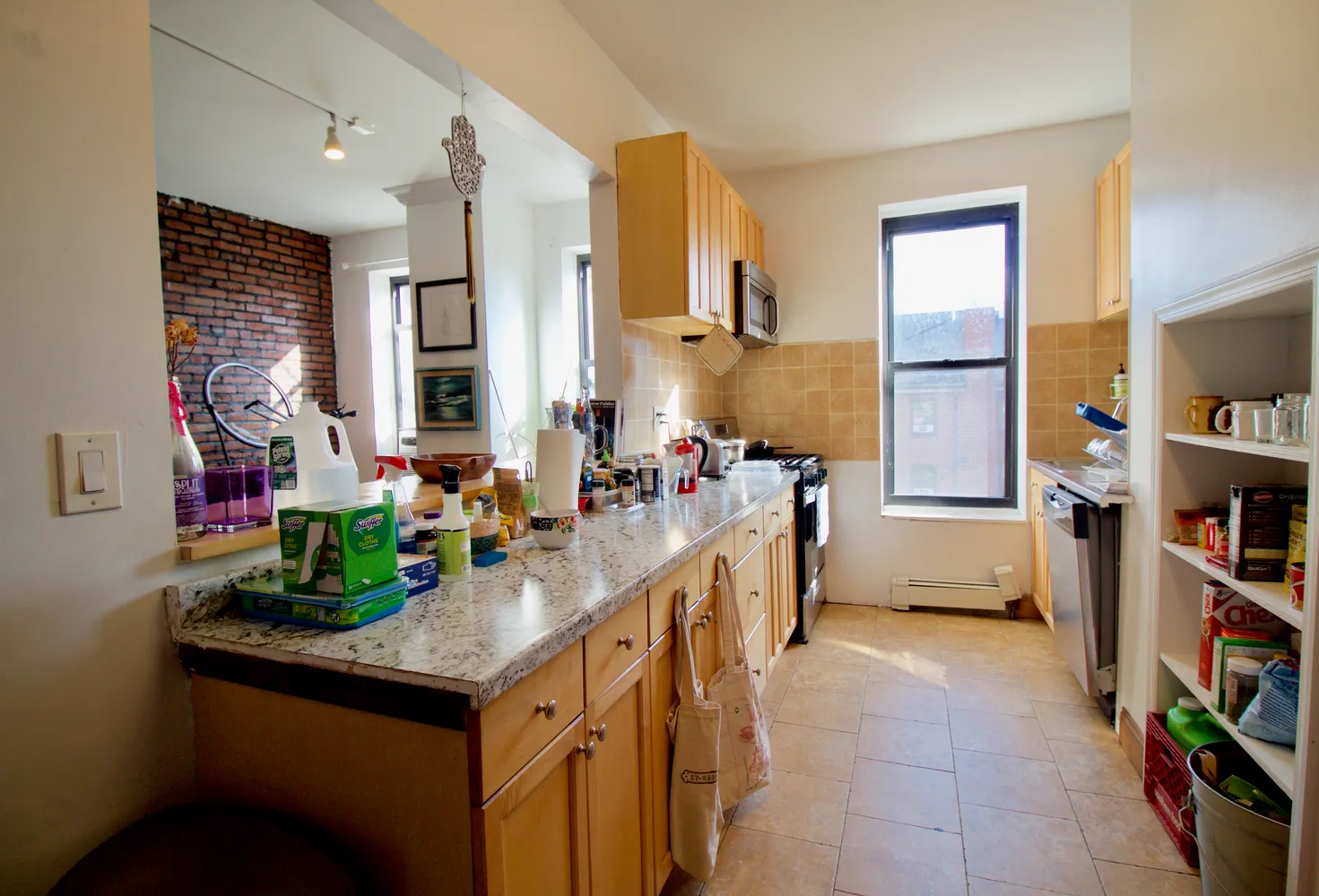 a kitchen with sink cabinets and appliances