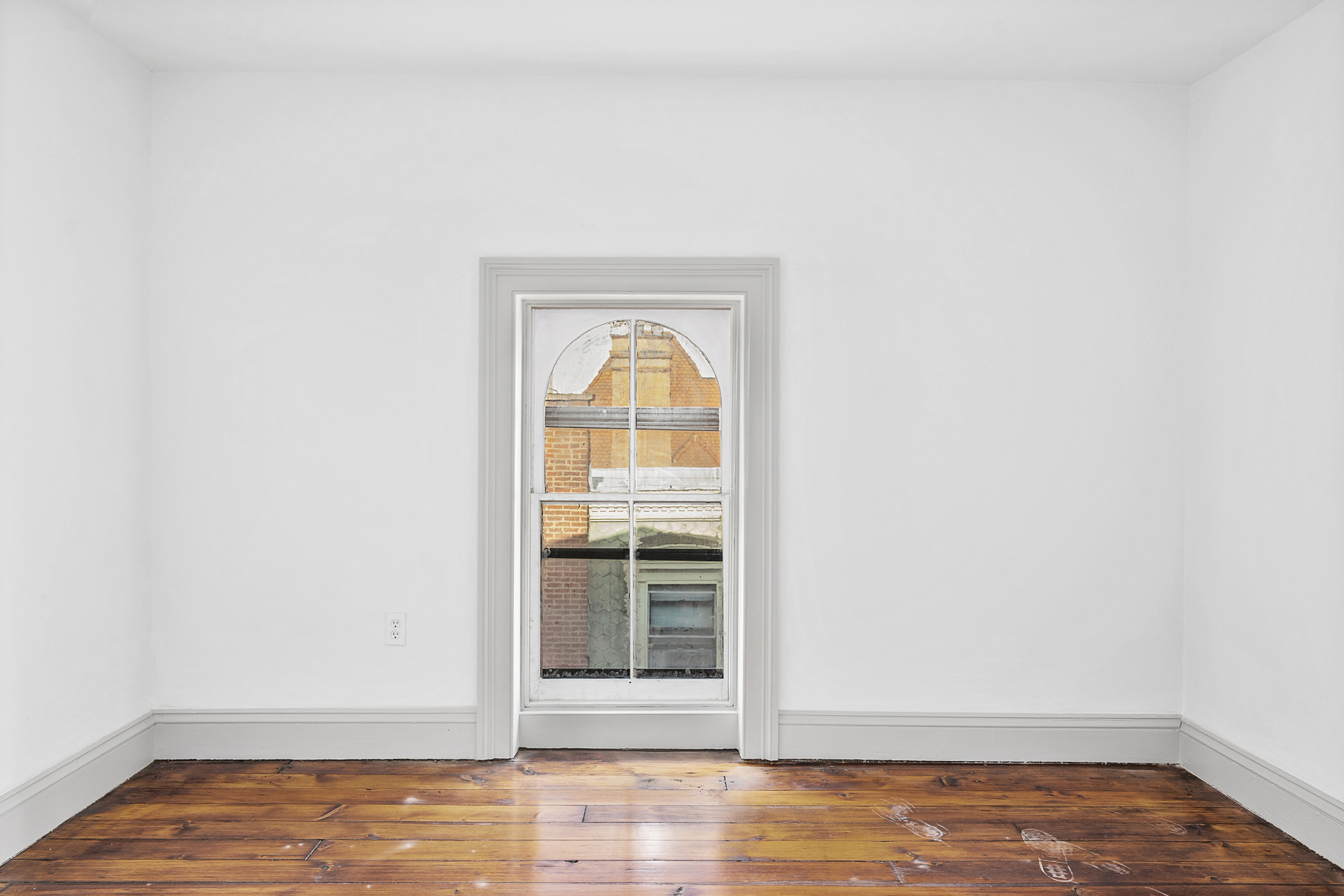 419 Clinton Avenue, Unit 2 Brooklyn, NY 11238 - Photo 9 of 11 a view of empty room with wooden floor and fan