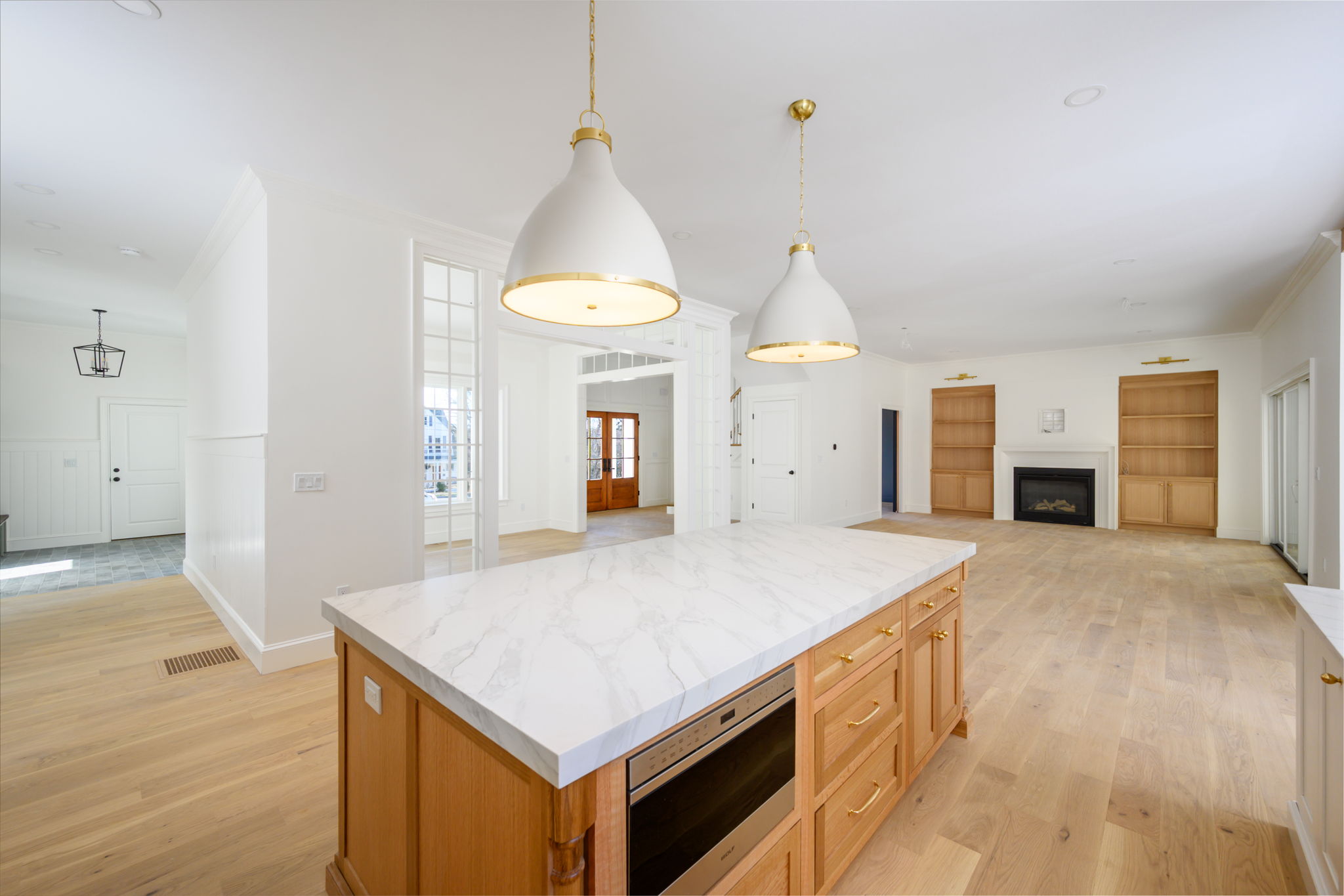 249 Central Avenue Milton, MA 02186 - Photo 14 of 61 a view of kitchen island and hallway
