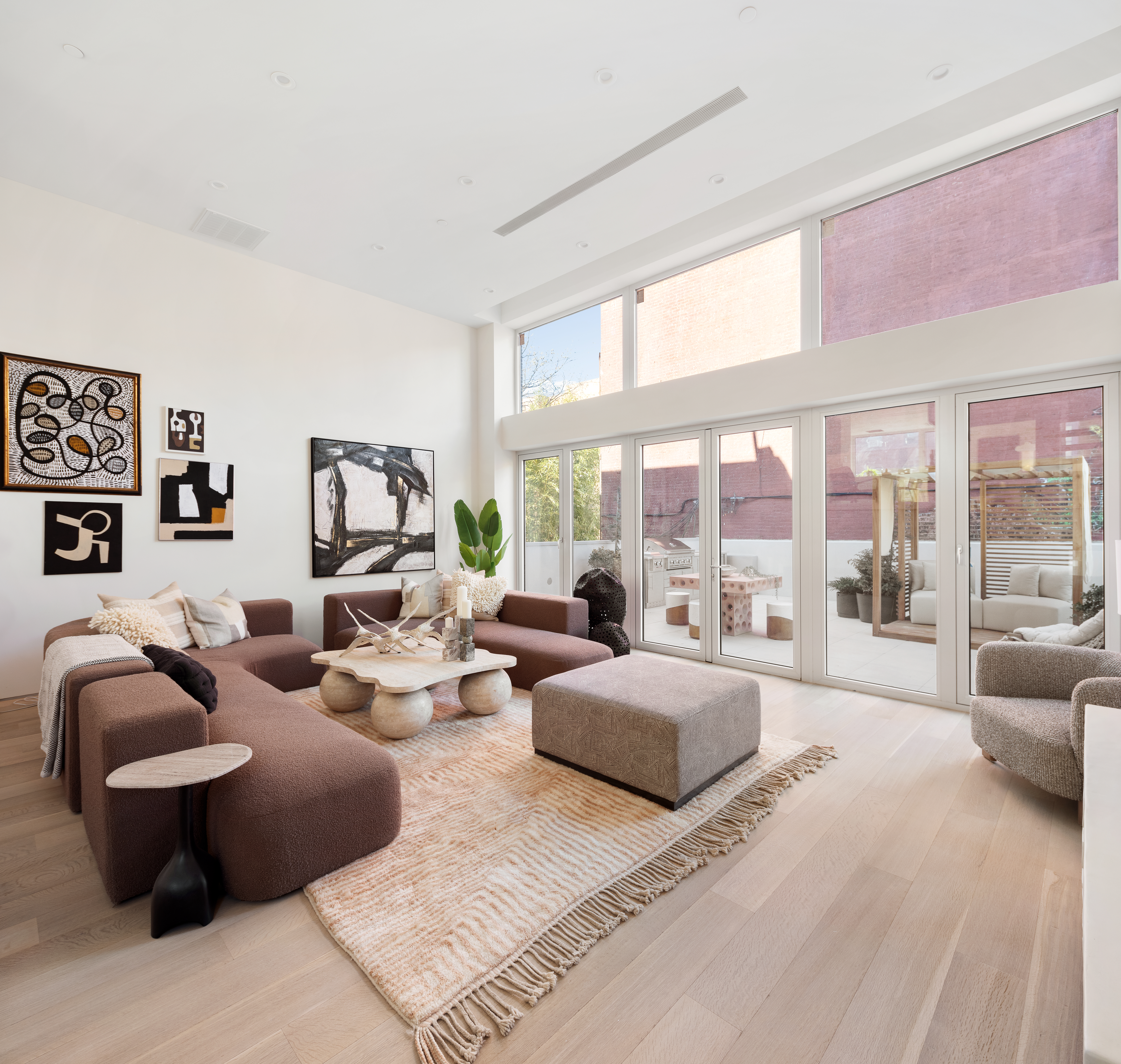 276 Berry Street Brooklyn, NY 11249 - Photo 5 of 36 a large bedroom with furniture and large windows