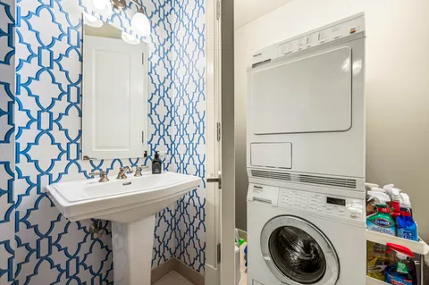 a bathroom with a sink mirror and vanity