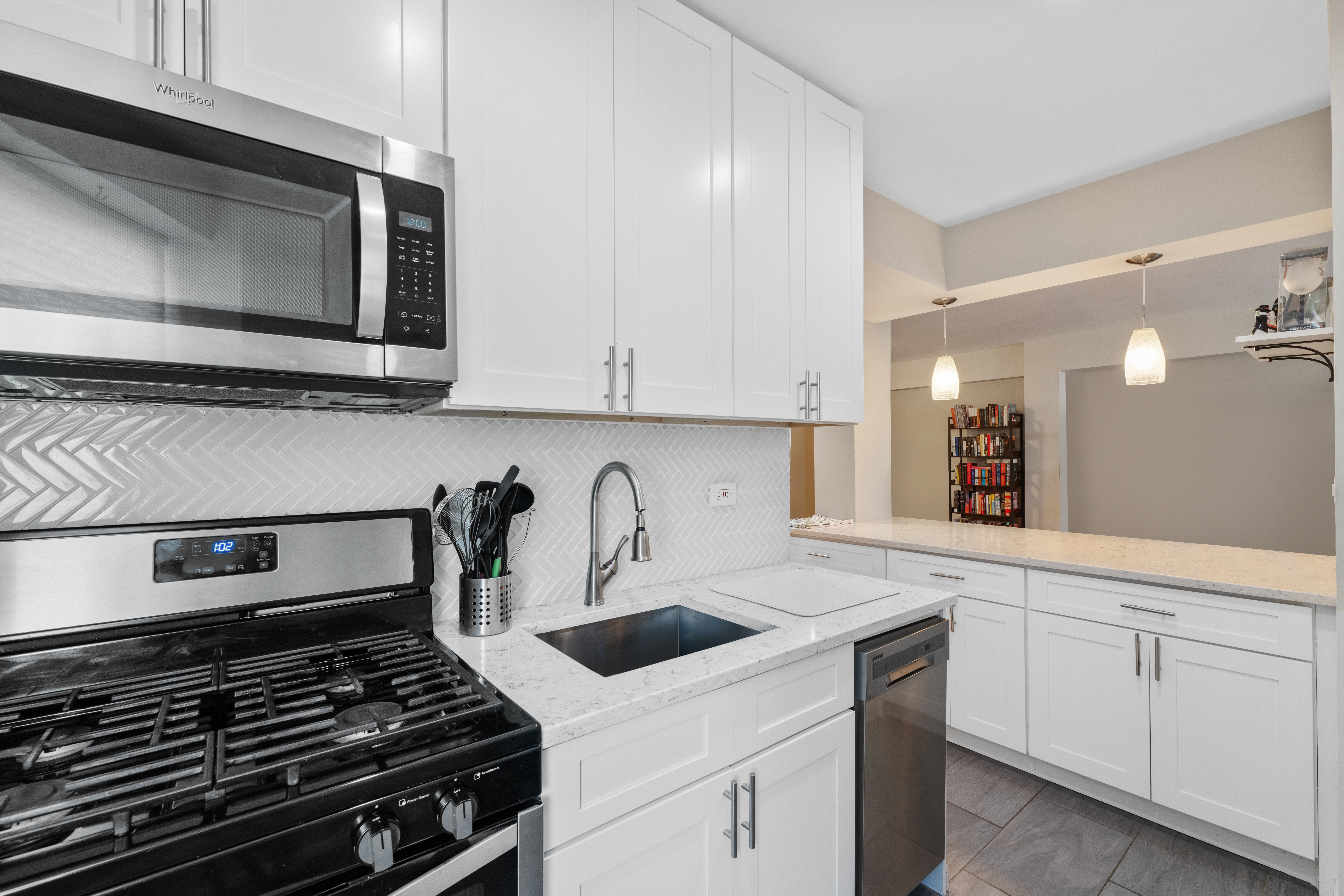 800 Grand Concourse, Unit 5JN Bronx, NY 10451 - Photo 5 of 7 a kitchen with white cabinets and appliances