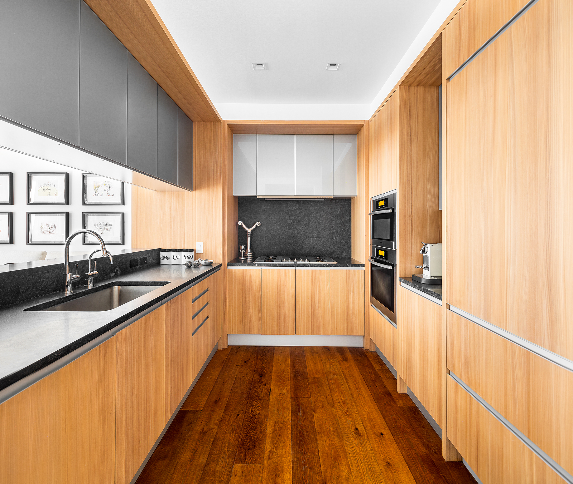 311 West Broadway, Unit 6J Manhattan, NY 10013 - Photo 6 of 19 a view of kitchen with wooden floor and electronic appliances