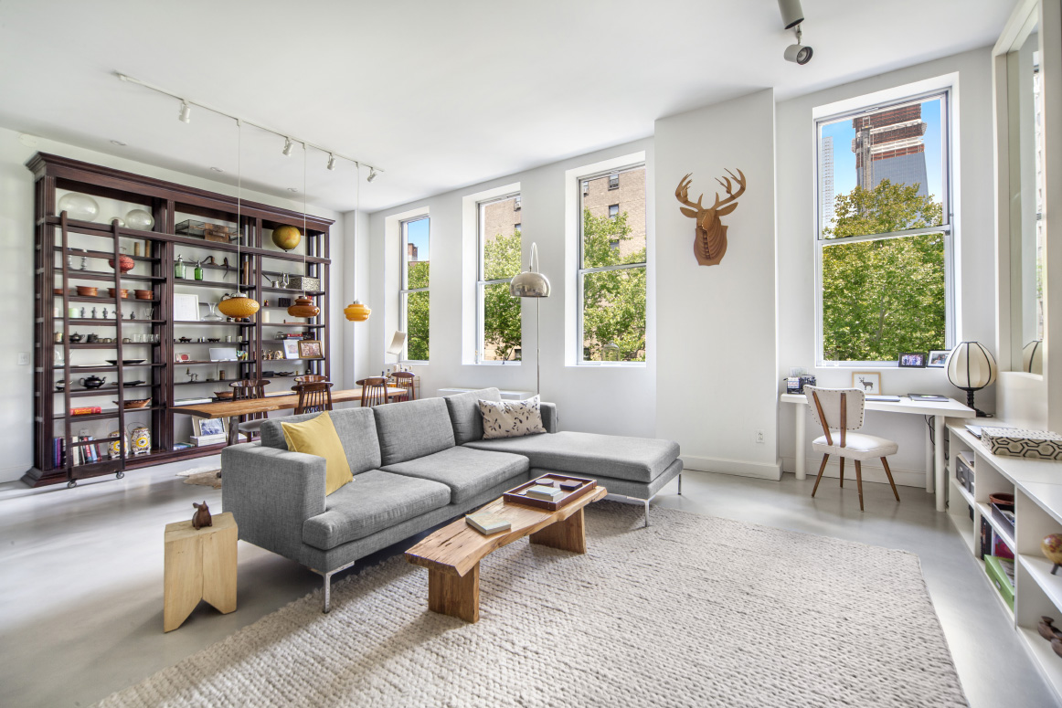 420 West 25th Street, Unit 3B Manhattan, NY 10001 - Photo 1 of 15 a living room with furniture and a window