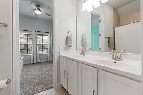 a bedroom with furniture and a window