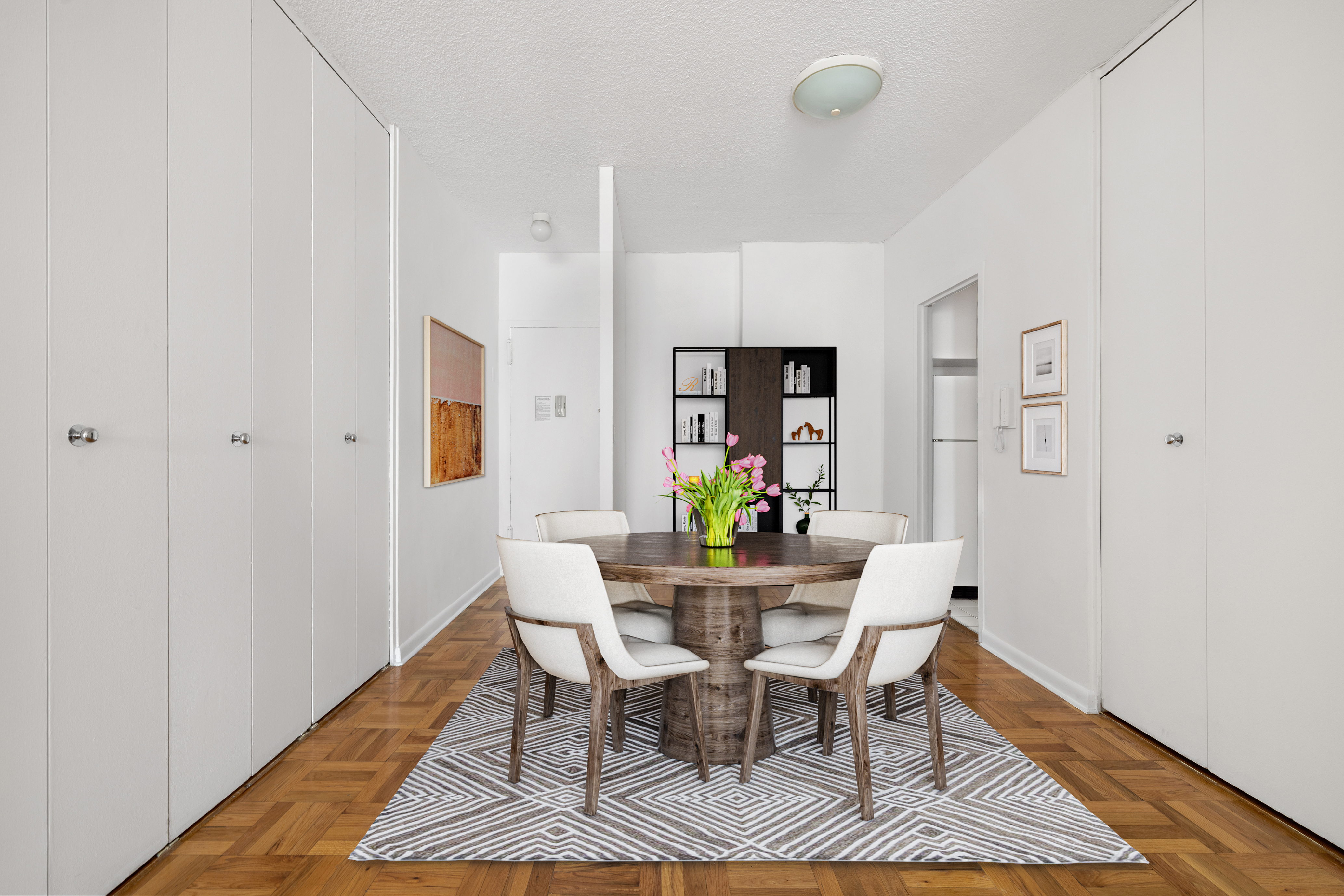 60 East 8th Street, Unit 15D Manhattan, NY 10003 - Photo 3 of 14 a view of a dining room with furniture