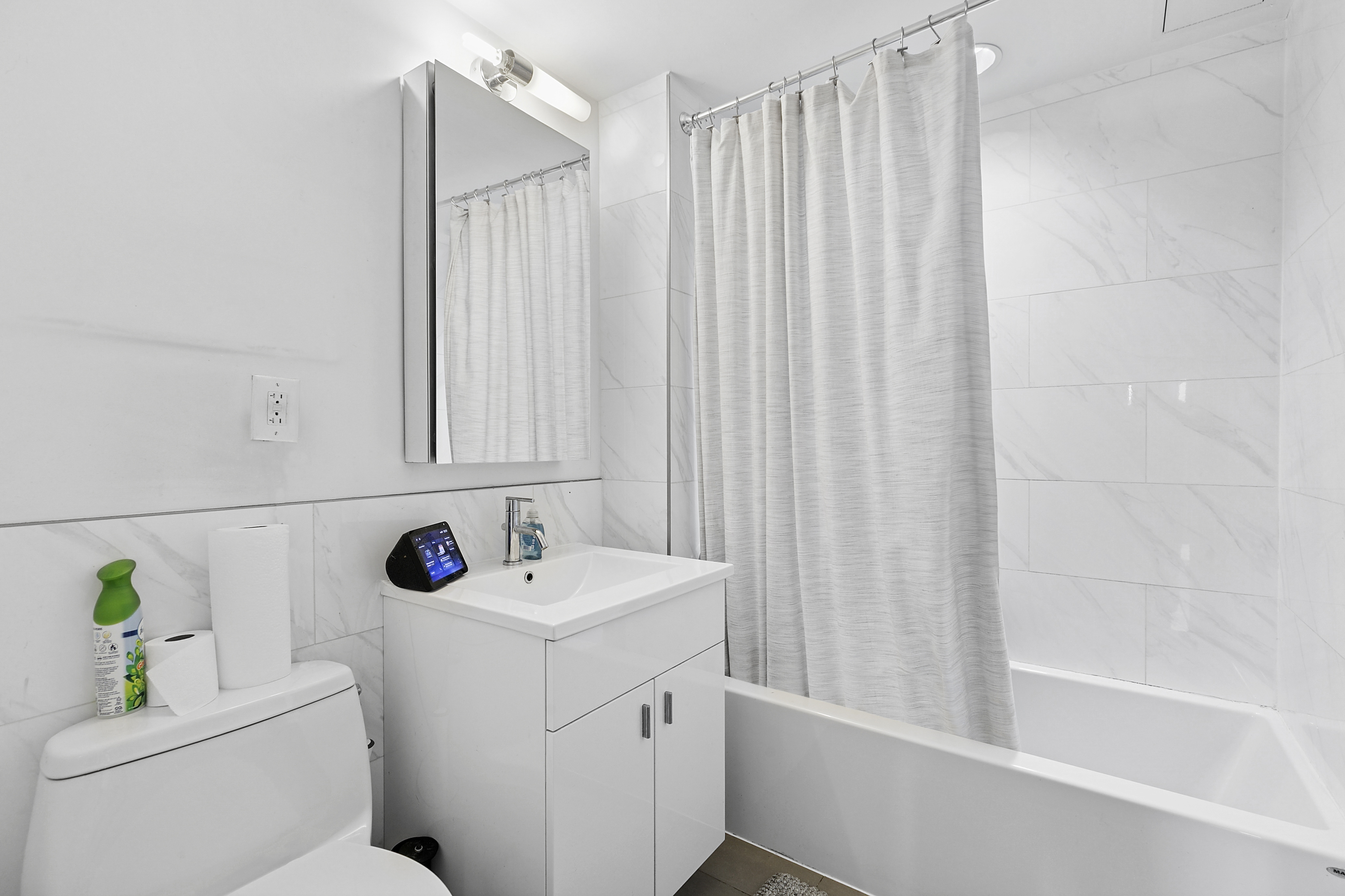 171 West 131st Street, Unit PH3 Manhattan, NY 10027 - Photo 6 of 13 a bathroom with a sink a toilet and shower