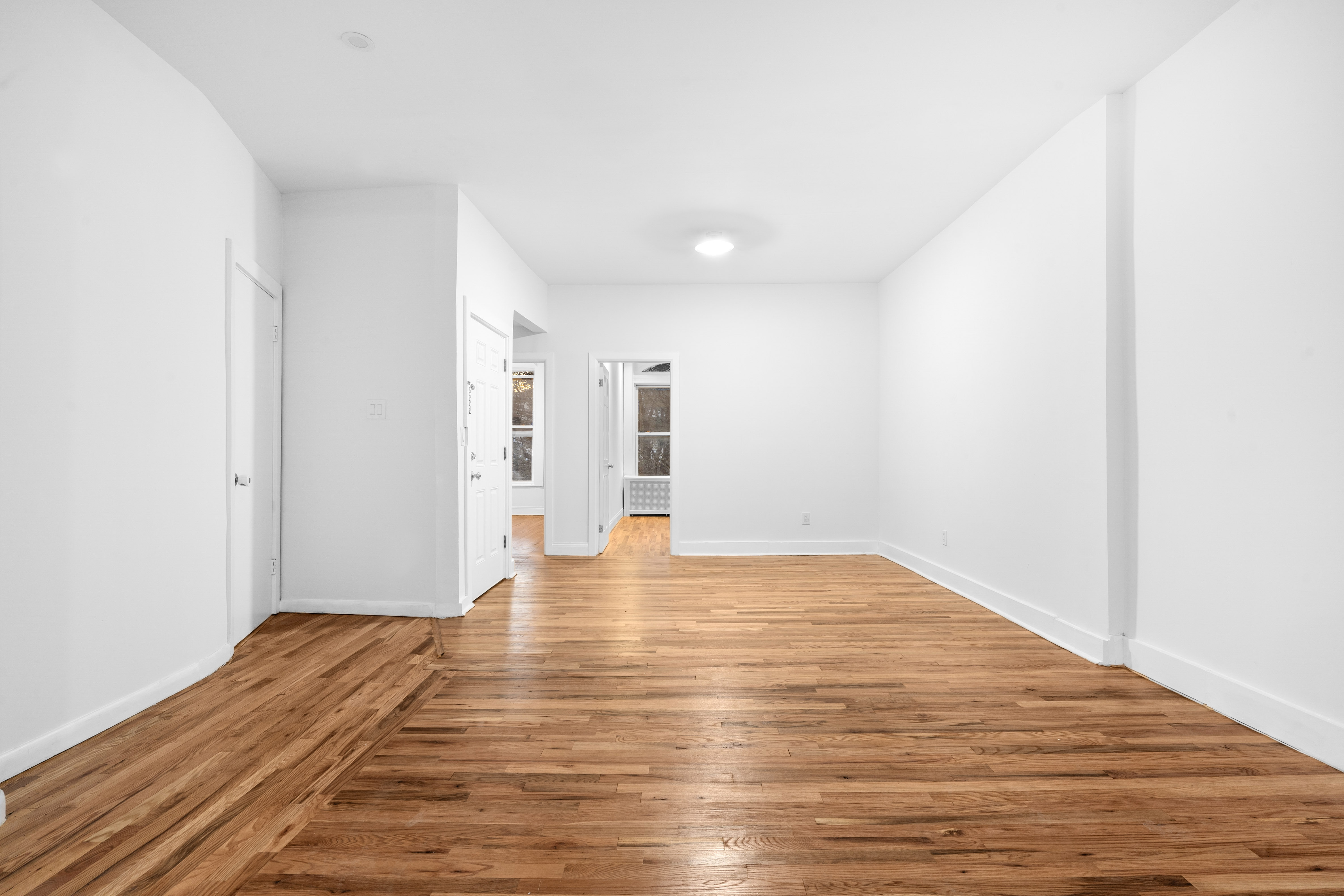 339 East 29th Street Brooklyn, NY 11226 - Photo 12 of 21 a view of empty room with wooden floor