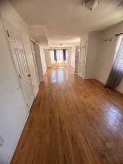 a view of wooden floor in an empty room