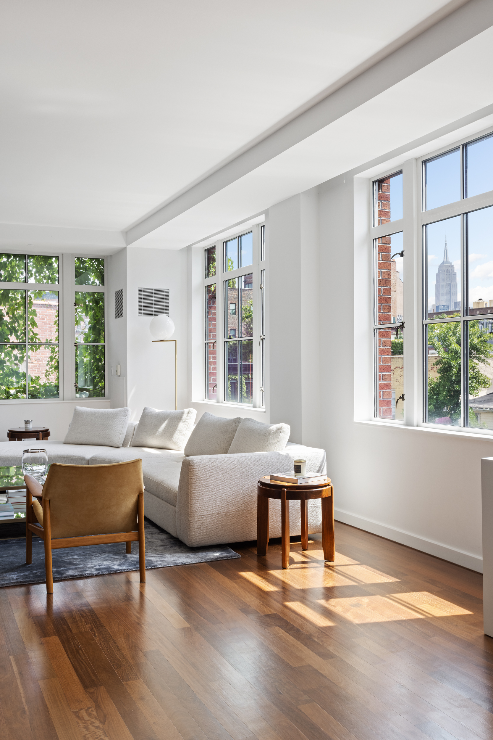 744 Greenwich Street, Unit 4 Manhattan, NY 10014 - Photo 15 of 34 a living room with furniture and large windows