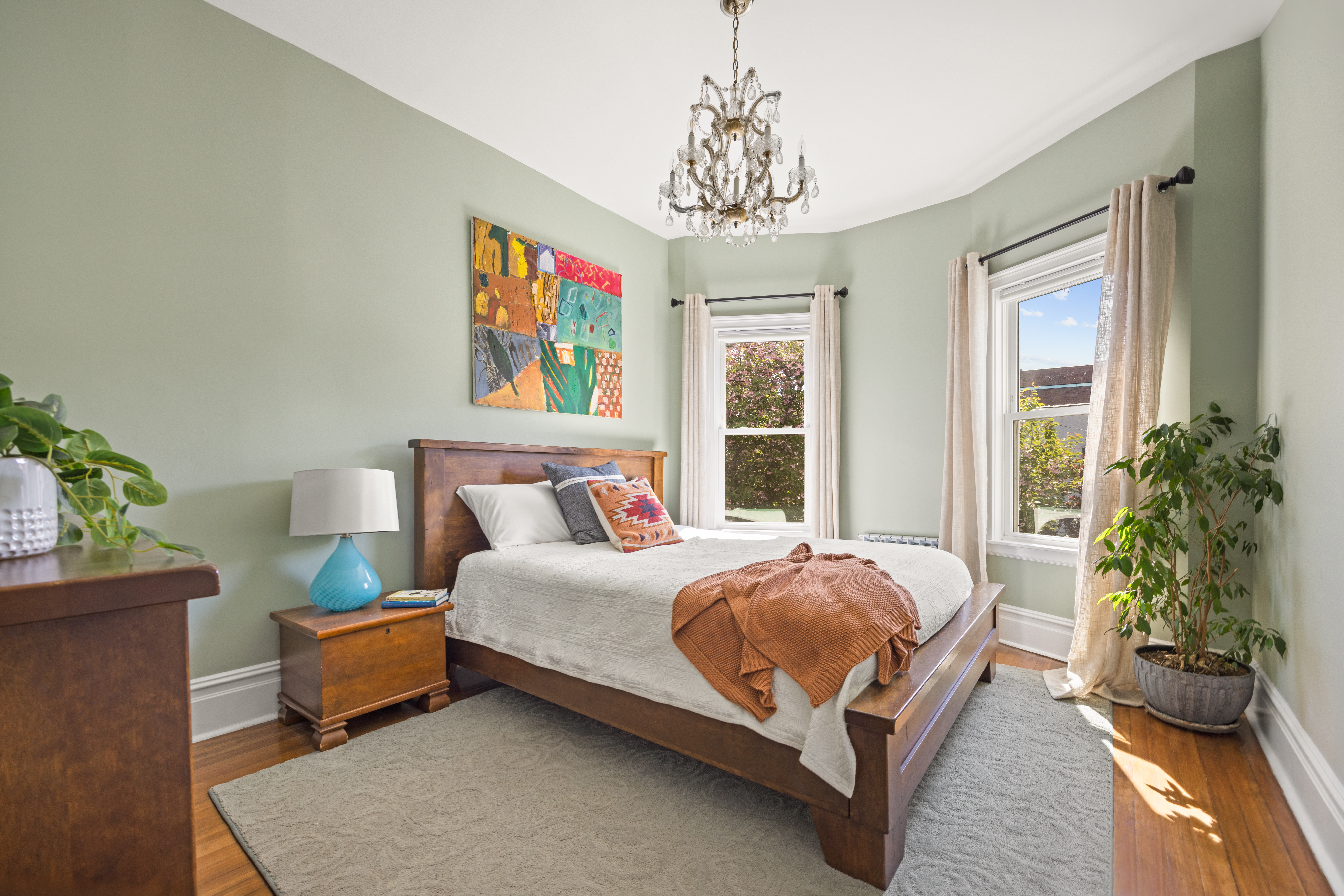 758 Westminster Road Brooklyn, NY 11230 - Photo 12 of 32 a spacious bedroom with a bed and a potted plant
