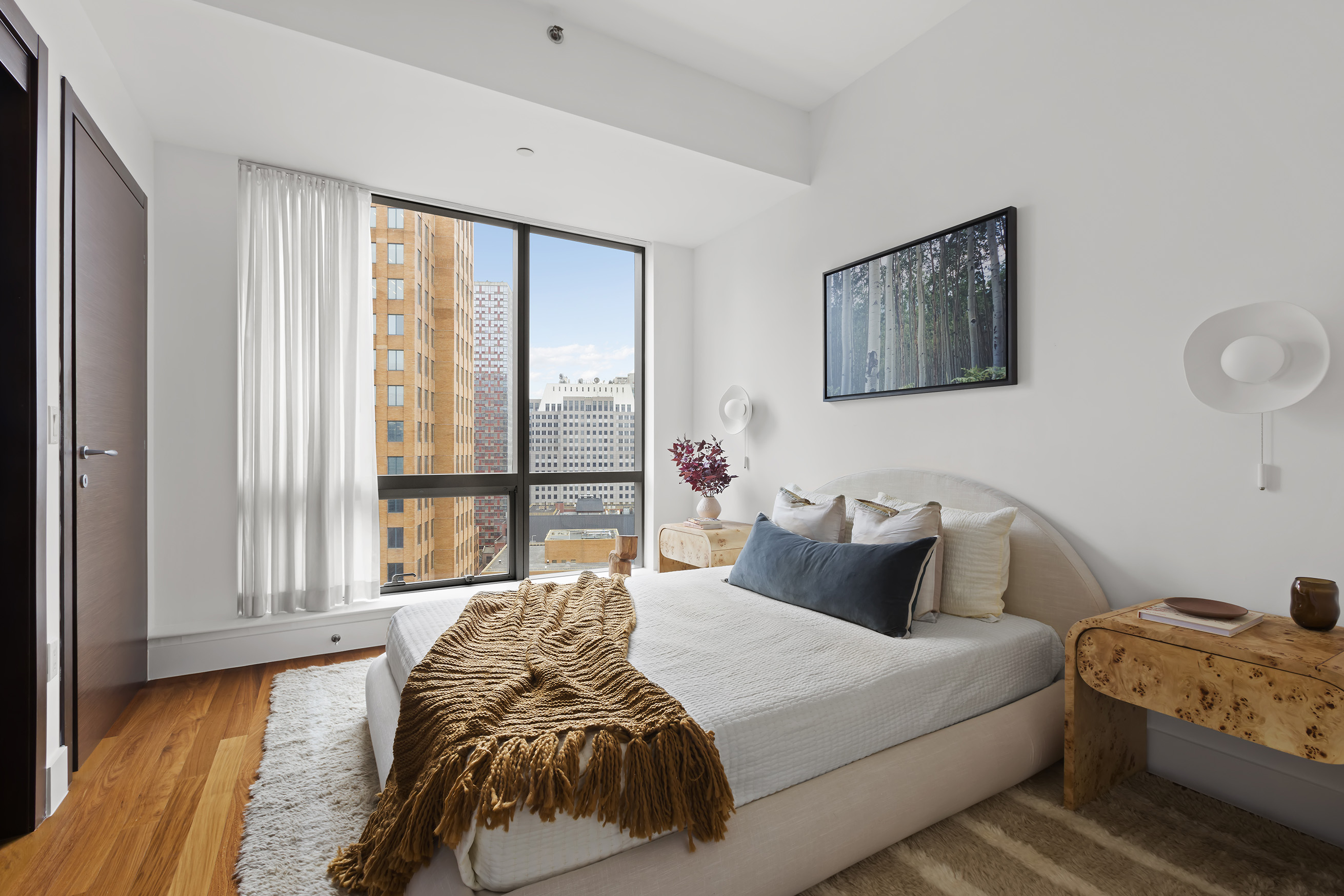 150 Myrtle Avenue, Unit 2506 Brooklyn, NY 11201 - Photo 12 of 16 a bedroom with a bed and a large window