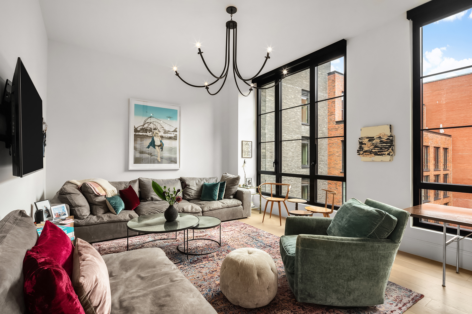 438 East 12th Street, Unit 6F Manhattan, NY 10009 - Photo 3 of 27 a living room with furniture and a flat screen tv