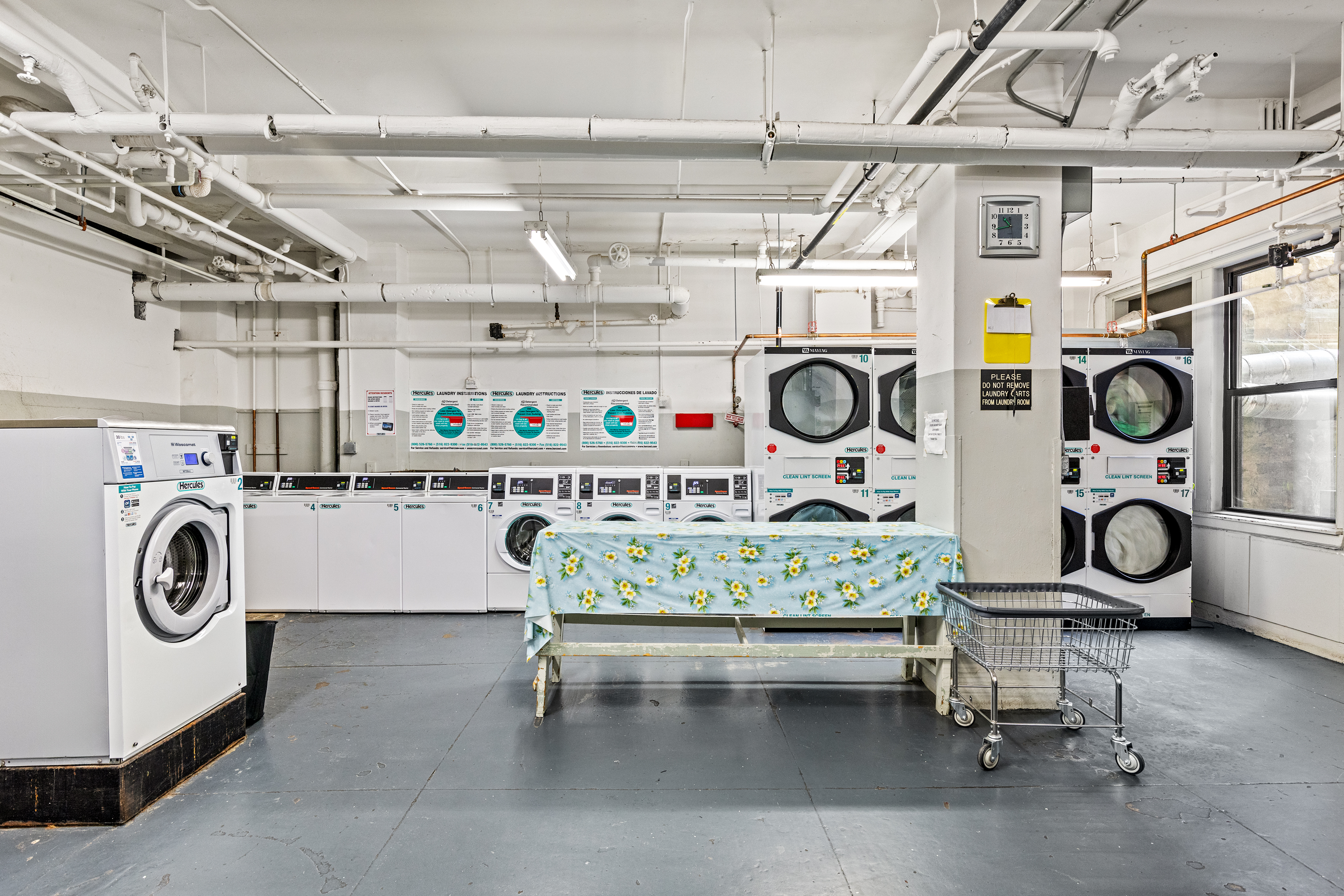 320 Riverside Drive, Unit 10G Manhattan, NY 10025 - Photo 14 of 16 a utility room with dryer and washer